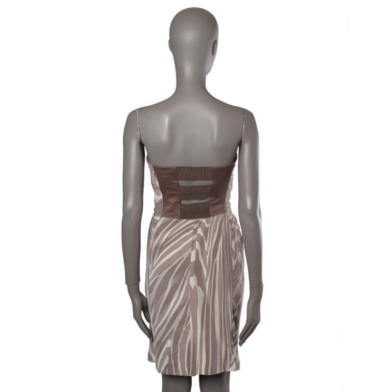 Gucci zebra print strapless dress in taupe and cream silk (97%) and elastane (3%) and back in mauve cotton (85%), silk (12%), and elastane (3%). With draping on from the side, boning, and three elastic bands on the back. Closes with invisible side