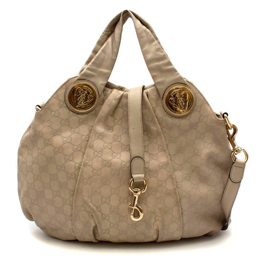 Gucci Taupe Guccissima Hysteria Tote

- Light grey top handle bag 
- GG leather print
- Detachable leather strap 
- Gold tone hardware 
- One main compartment
- Magnetic push button fastening  
- Printed cloth lining 
- Single zip fastening

This