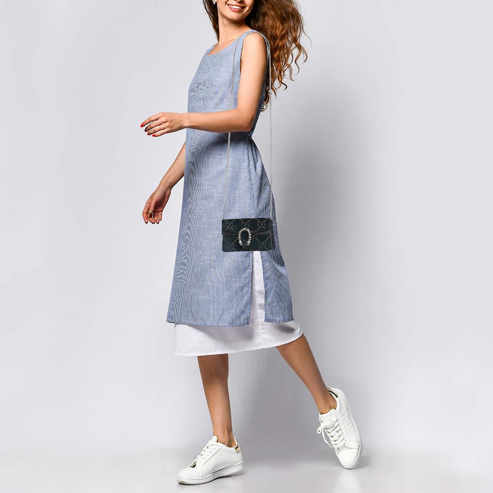 Crafted from rich teal blue GG velvet  this Gucci super mini bag features the iconic Dionysus motif with its signature tiger head closure  symbolizing strength and power. The combination of sumptuous velvet and smooth leather adds depth and texture 
