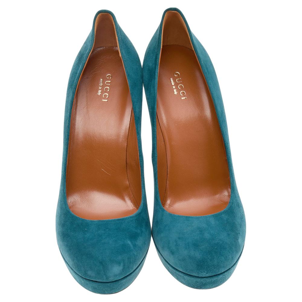 The House of Gucci is back with another marvelous creation! These pumps are made from teal blue suede on the exterior and feature rounded toes, a chic silhouette, platforms, and towering heels. Look glamorous and trendy as you wear these Gucci pumps