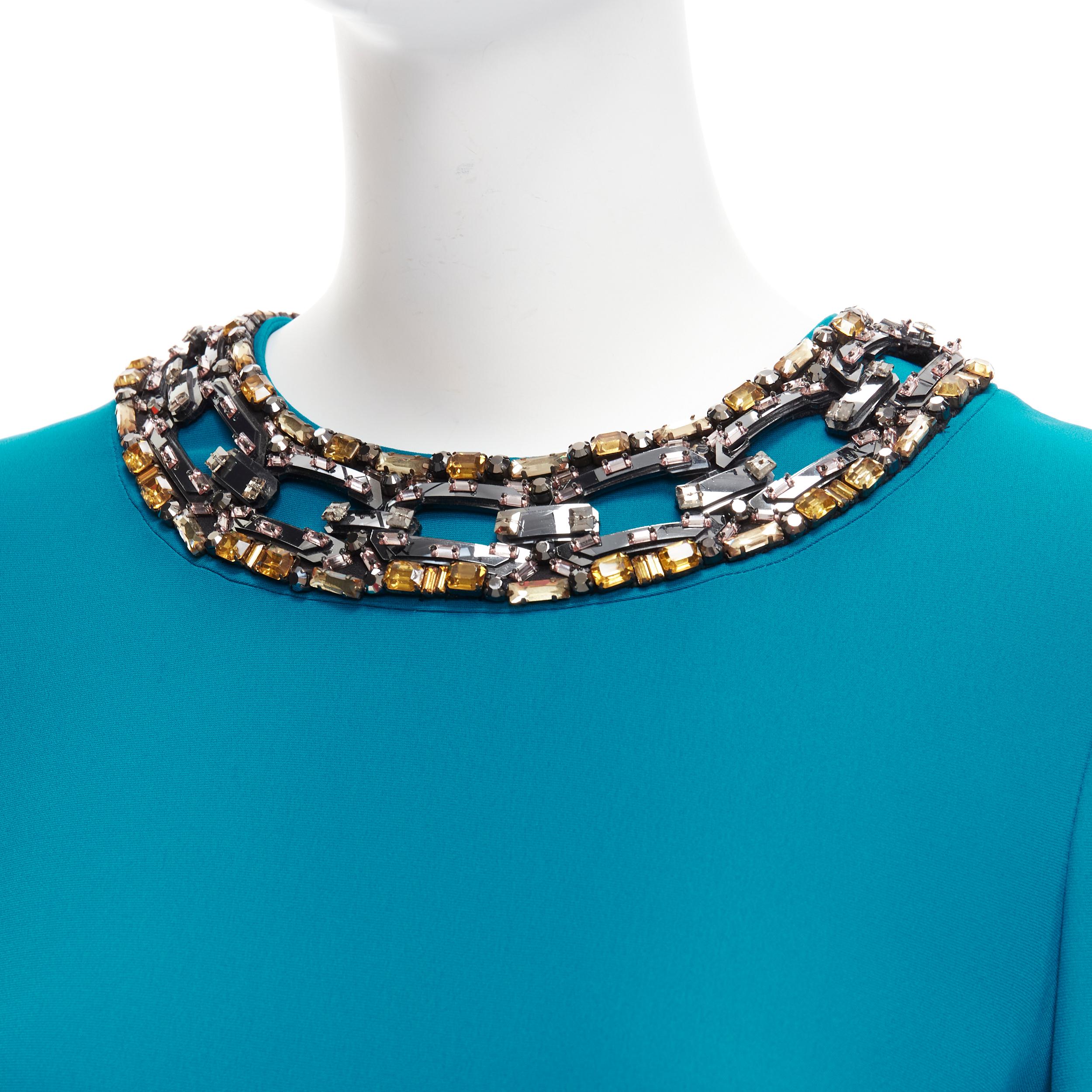GUCCI teal blueyellow silver crystal chunky chain embellishment shift dress IT40 S
Reference: CC/A00403
Brand: Gucci
Material: Silk
Color: Blue
Pattern: Solid
Closure: Zip
Lining: Blue Fabric
Extra Details: Back zip.
Made in: