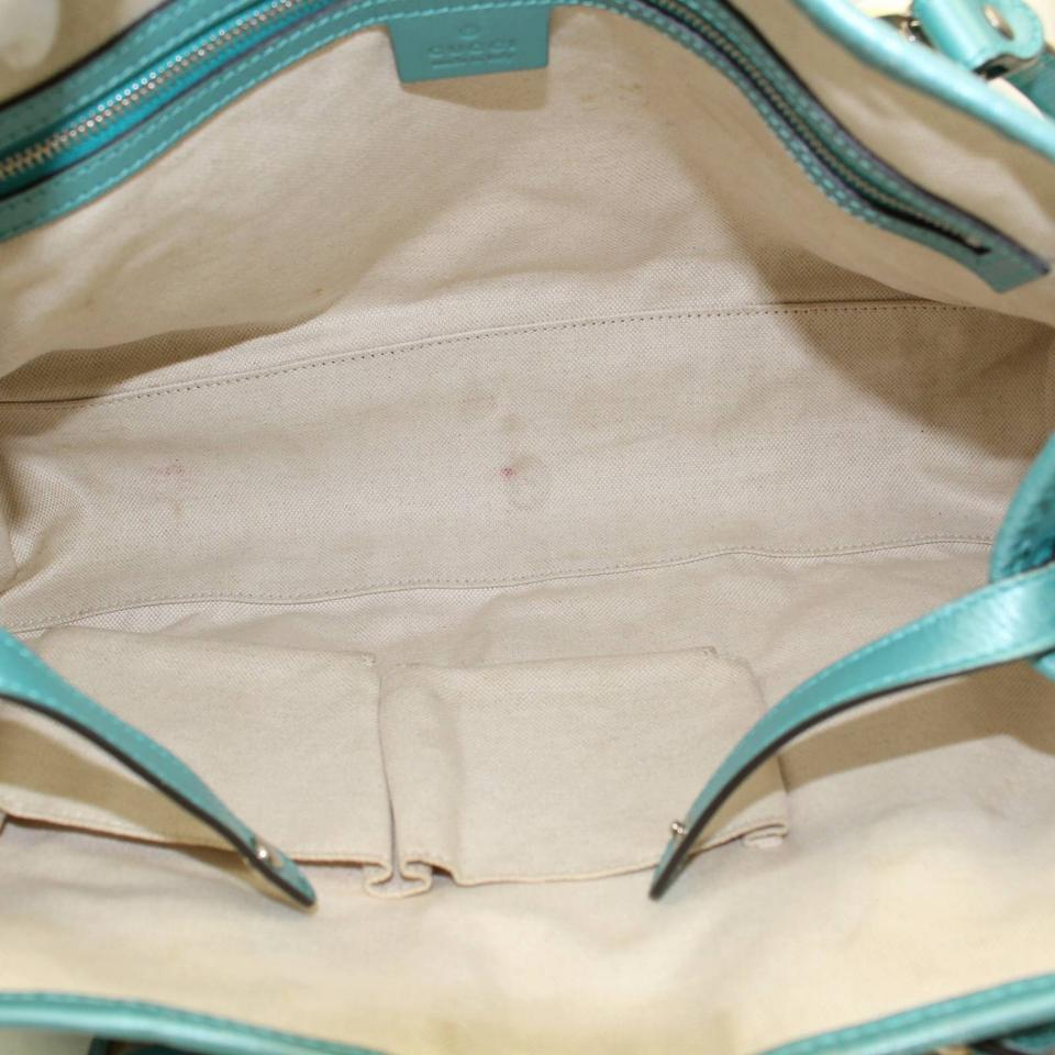 teal gucci purse