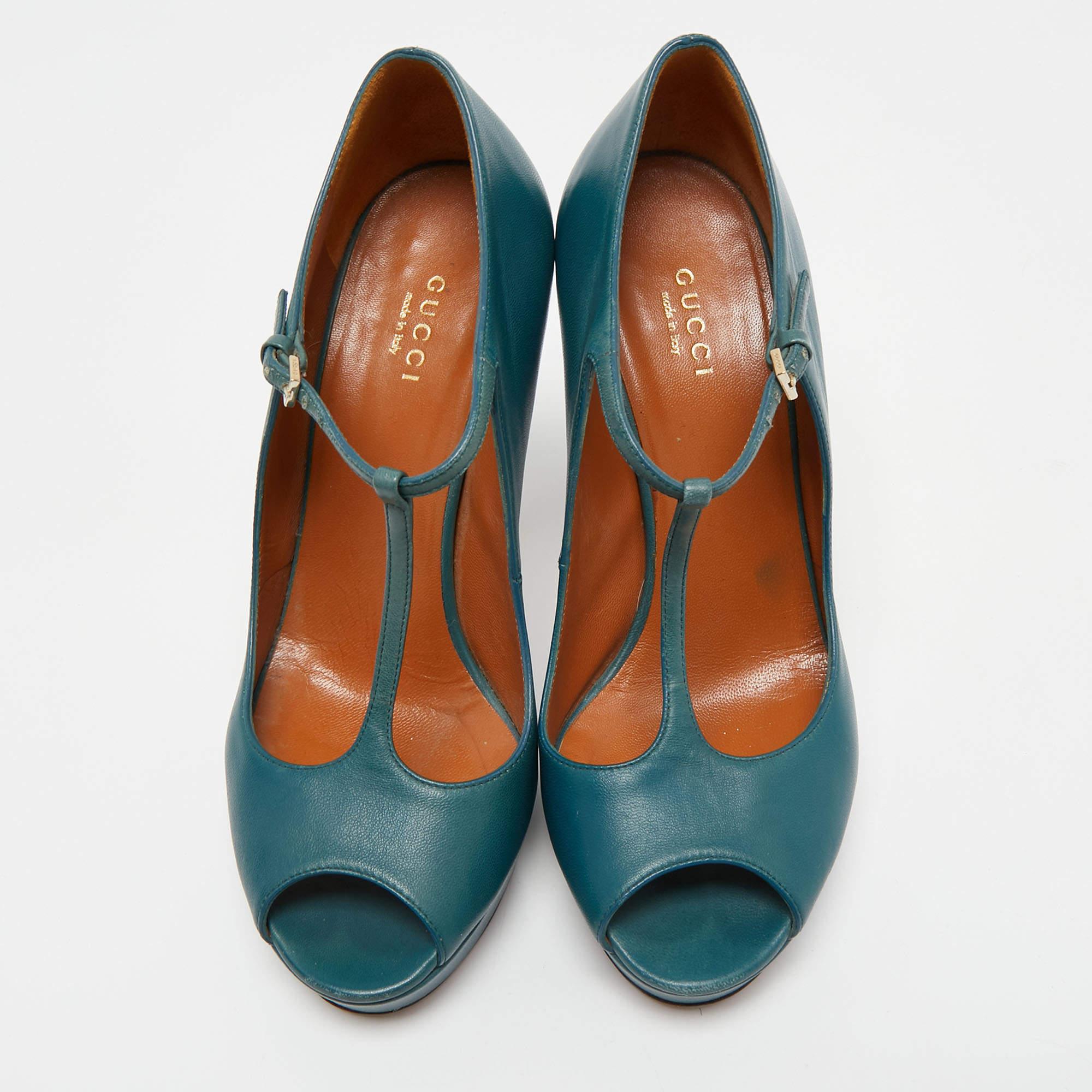 Flaunt elegance and style with this pair of leather pumps. Gucci has made these T-strap betty pumps with platforms and 12cm heels. This classy teal pair is suitable for work, parties, or even day events.

