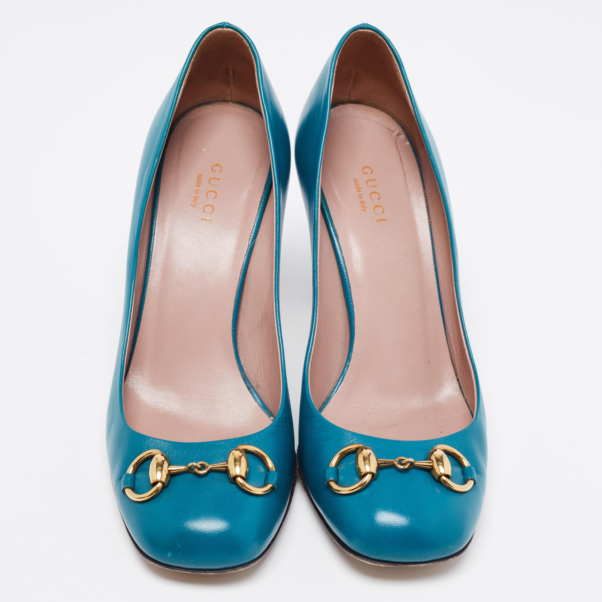 Gucci's Jolene pumps are a classy and chic creation that is impossible to resist! From formal outfits to casual attires, these pumps are perfect to wear. This version of the Jolene pumps is made from teal leather and highlighted with a gold-tone