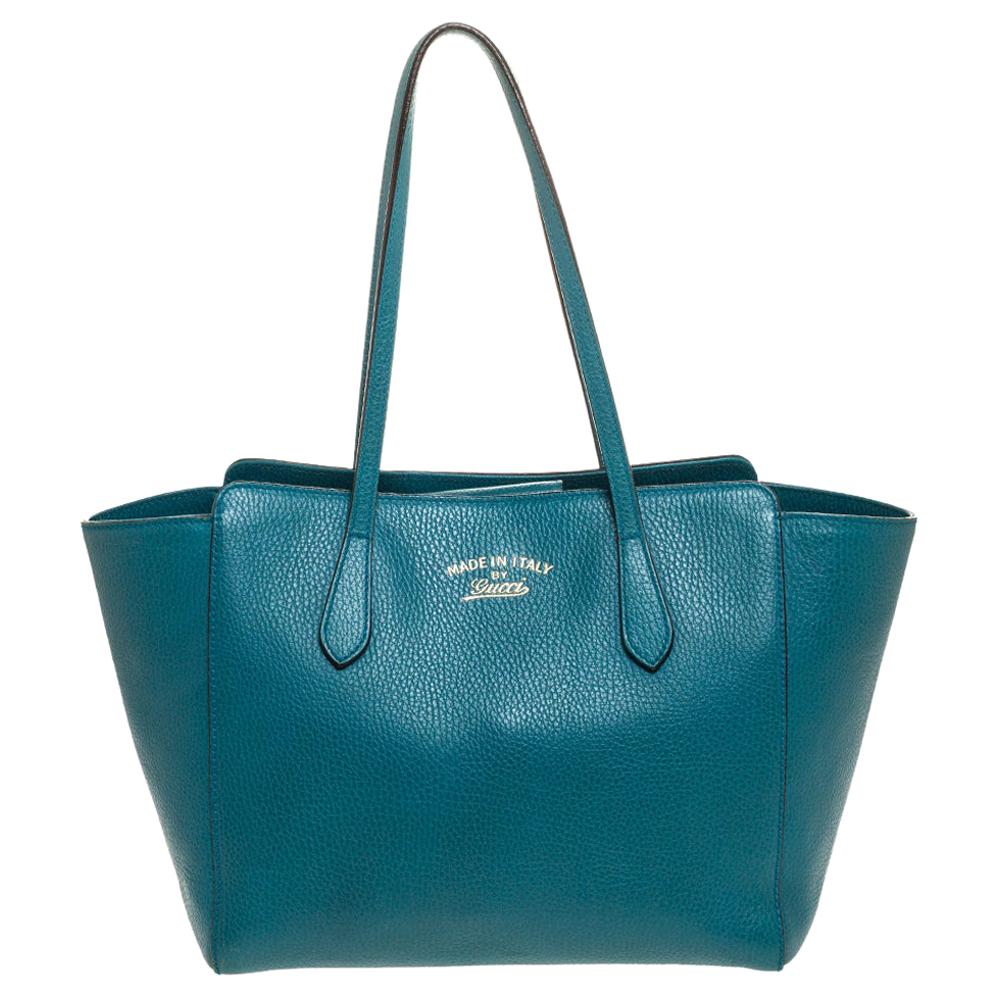 teal colored purses