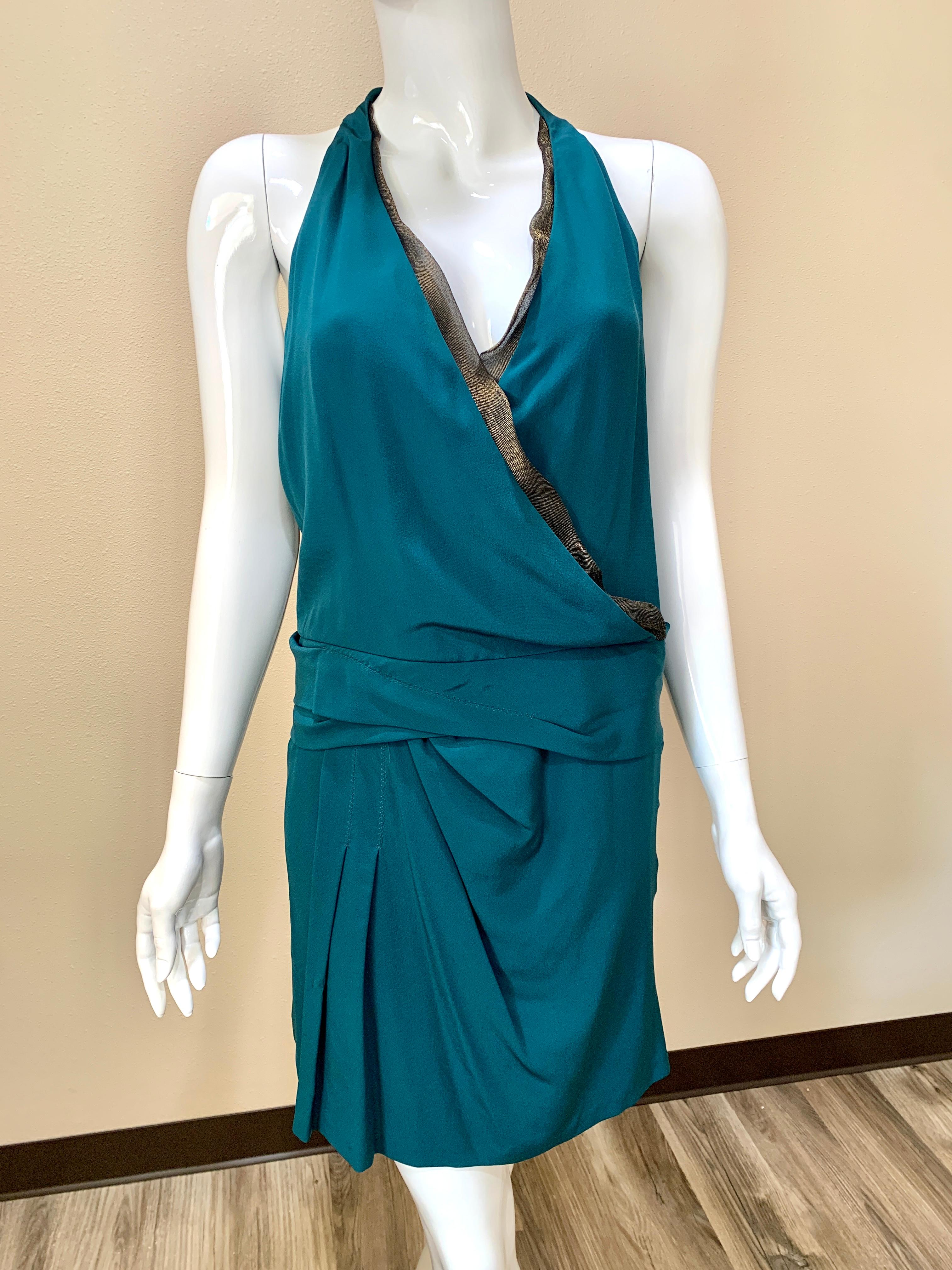 Gucci Teal Halter Cocktail Dress - with many different options to style it! 
Inner black gold inlay on the neck and detailed tassels with attached scarf. 
Scarf can hang in the back or the front or wrap around the neck (see attached photos). 
100%