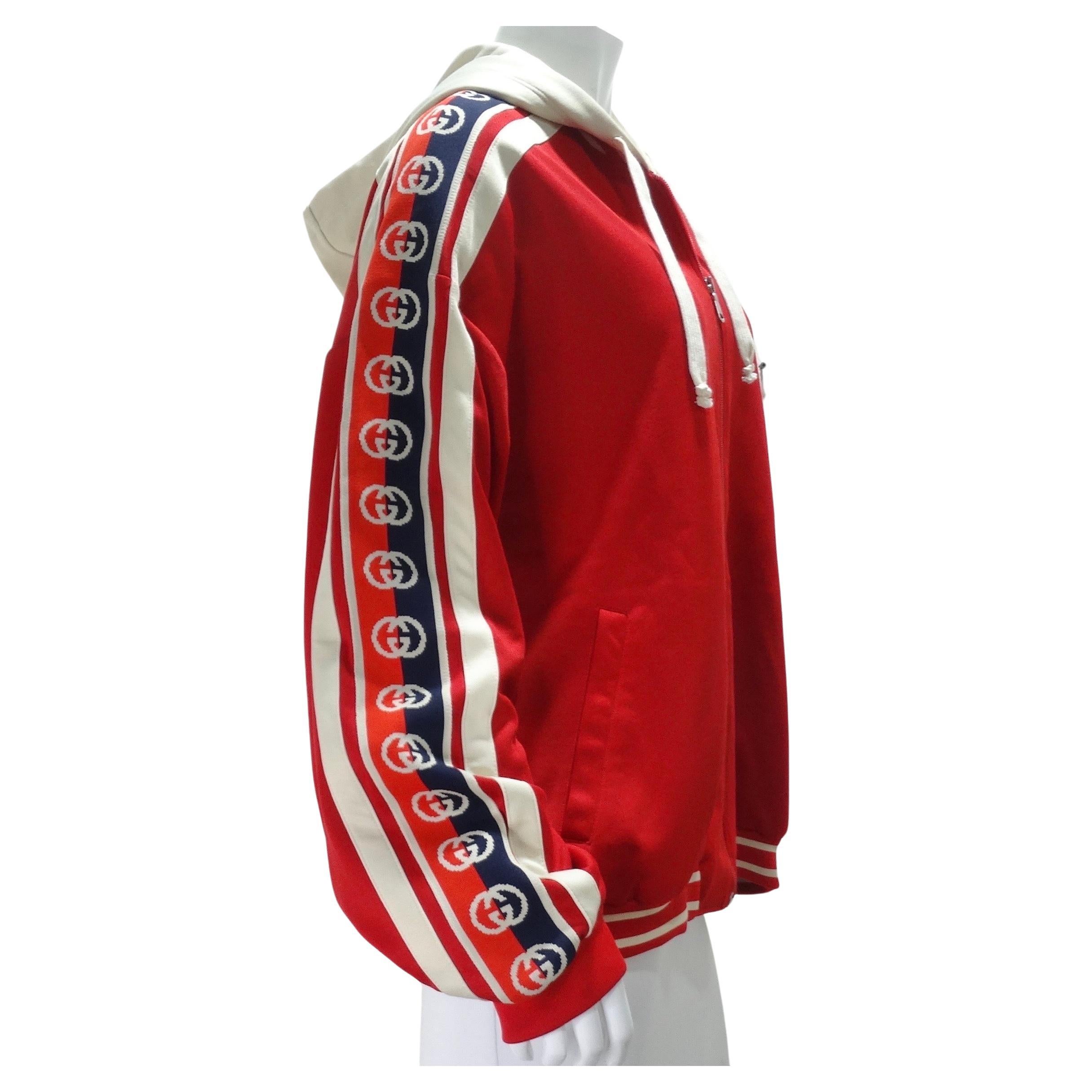 This Gucci zip-up hoodie is going to become your next go-to piece to throw on over any look! Super comfortable and versatile Gucci jacket in the most vibrant cherry red with red and white accents. Featuring a center zipper, side pockets and a