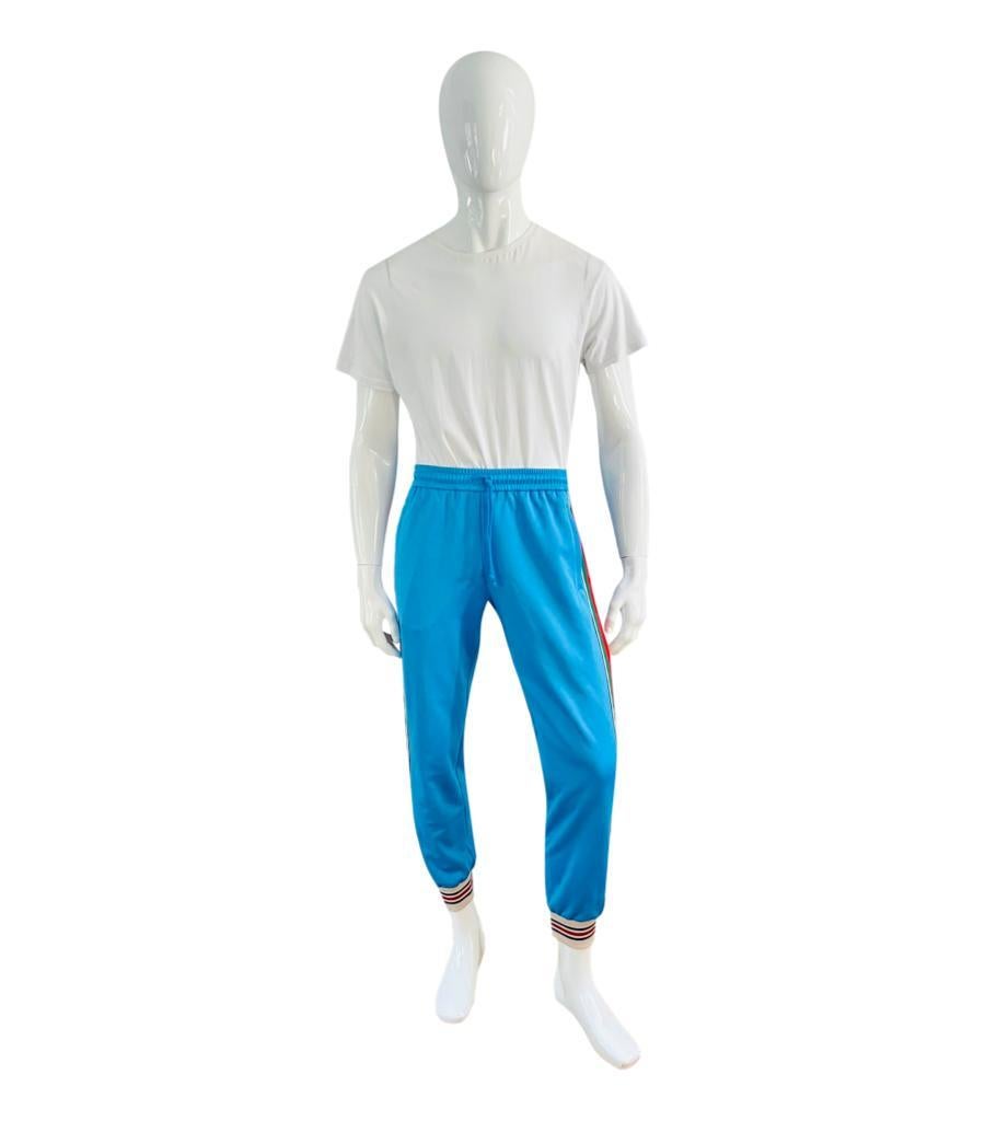 Brand New - Gucci Technical Jersey Web Stripe Track Bottoms

Blue track pants imbued with vintage, sportswear inspired feel.

Detailed with iconic red and green ribbon web stripe down the legs and interlocking 'GG' logo patch to the rear