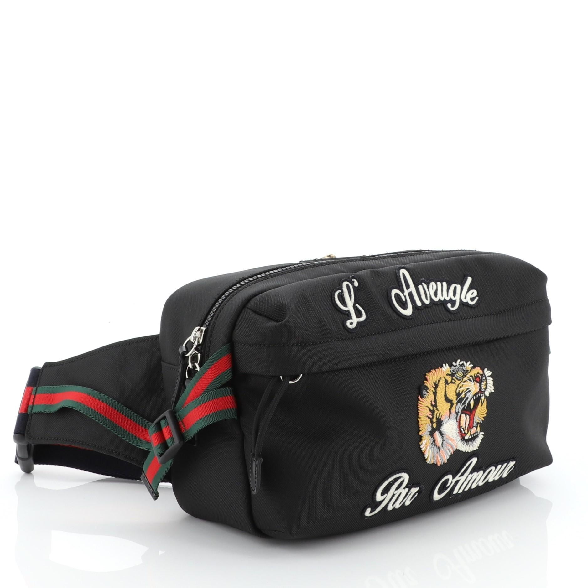 This Gucci Techpack Belt Bag Embroidered Techno Canvas is a chic piece reminiscent of 90s fashion, necessary to stay on the cutting edge. Crafted from black embroidered techno canvas, it features a web belt strap, exterior zip pocket and black-tone