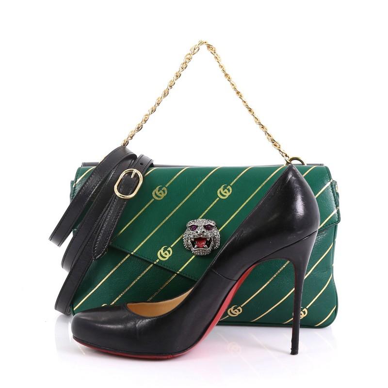 This Gucci Thiara Double Shoulder Bag Printed Leather Medium, crafted from green printed leather and black leather, features chain link top handle, crystal-embellished tiger head and GG logo, two flap compartments, and aged gold-tone hardware. Its