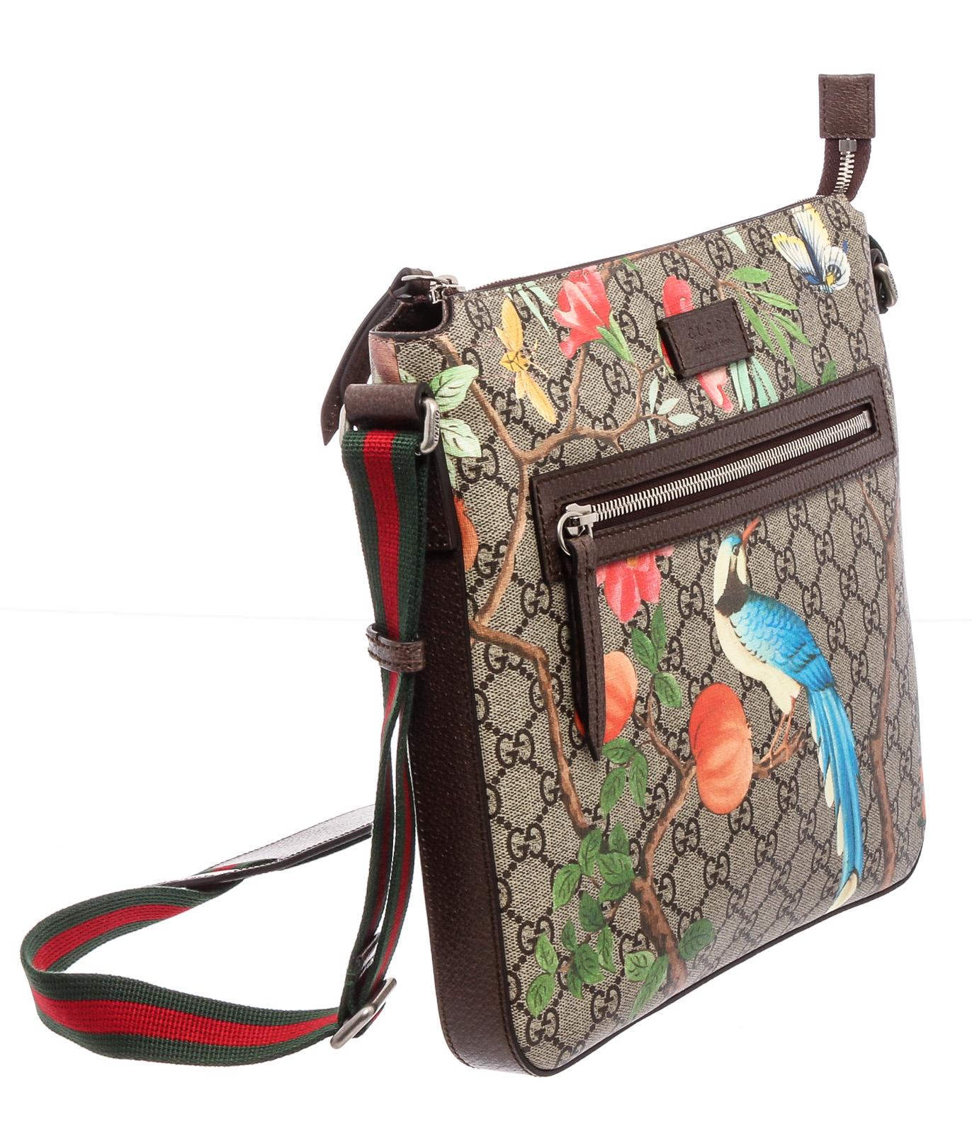 Beige and multicolor GG Supreme Tian coated canvas Gucci messenger bag with silver-tone hardware, single red and green Web flat shoulder strap with shoulder guard, brown leather trim, single zip pocket and embossed logo at front face, light brown