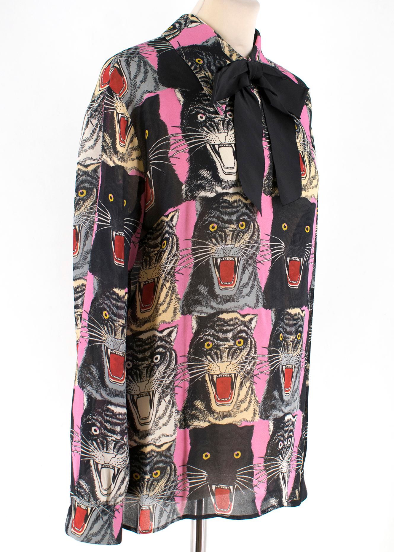 Gucci Tiger Face Print Sable Shirt

- Black Neck Bow 
- Back Button Down Detail 
- Buttoned Cuffs
- Straight Hemline 
- Repetitive Tiger Face Print 

100% Viscose 
Details 
100% Silk 

Remove the Bow Before Washing 

Dry Clean Only 

Made in