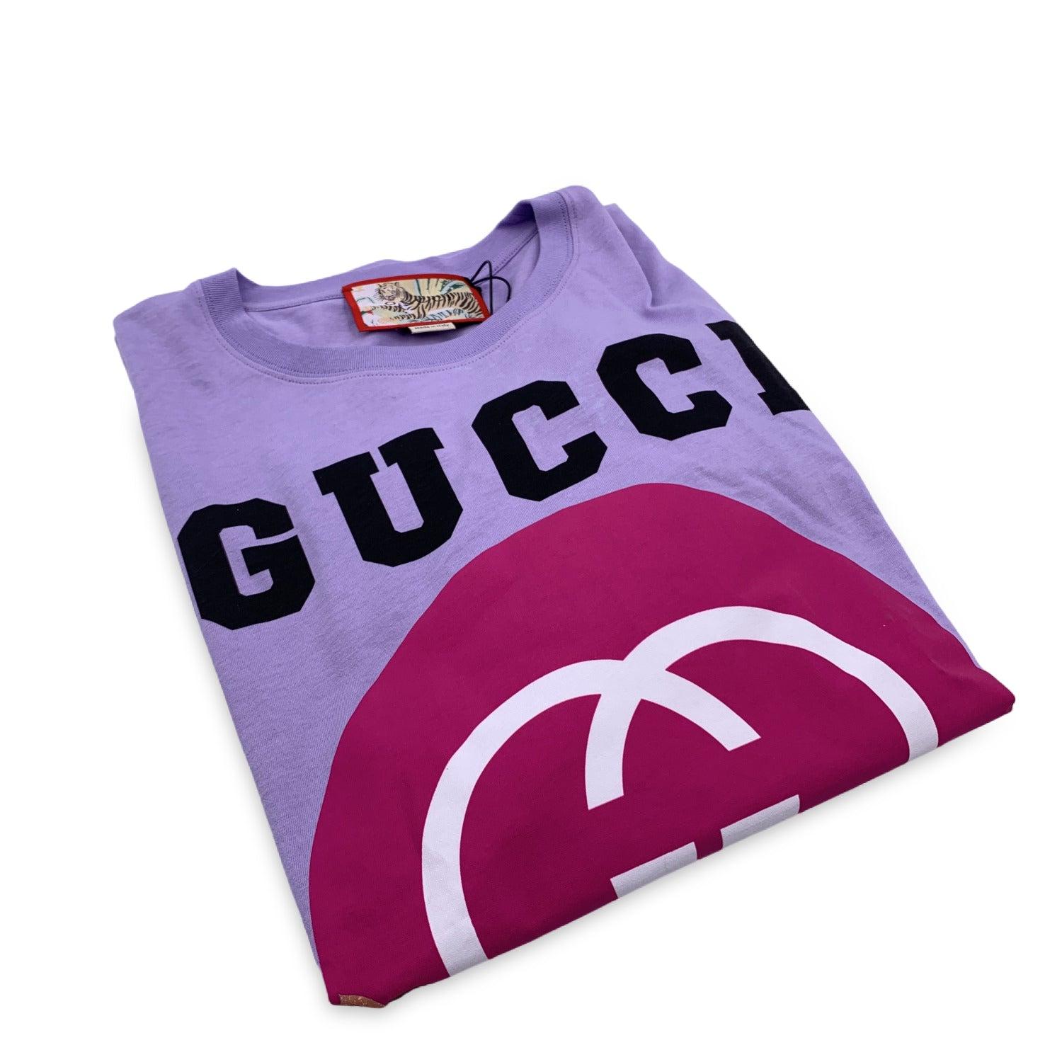 Light Purple 'Gucci Tiger' Unisex T-shirt. Made of 100% cotton. Printed 'Gucci Tiger', logo and tiger on the front. Round neck. Size: M (The size shown for this item is the size indicated by the designer on the label). Retail price is 550 euros.