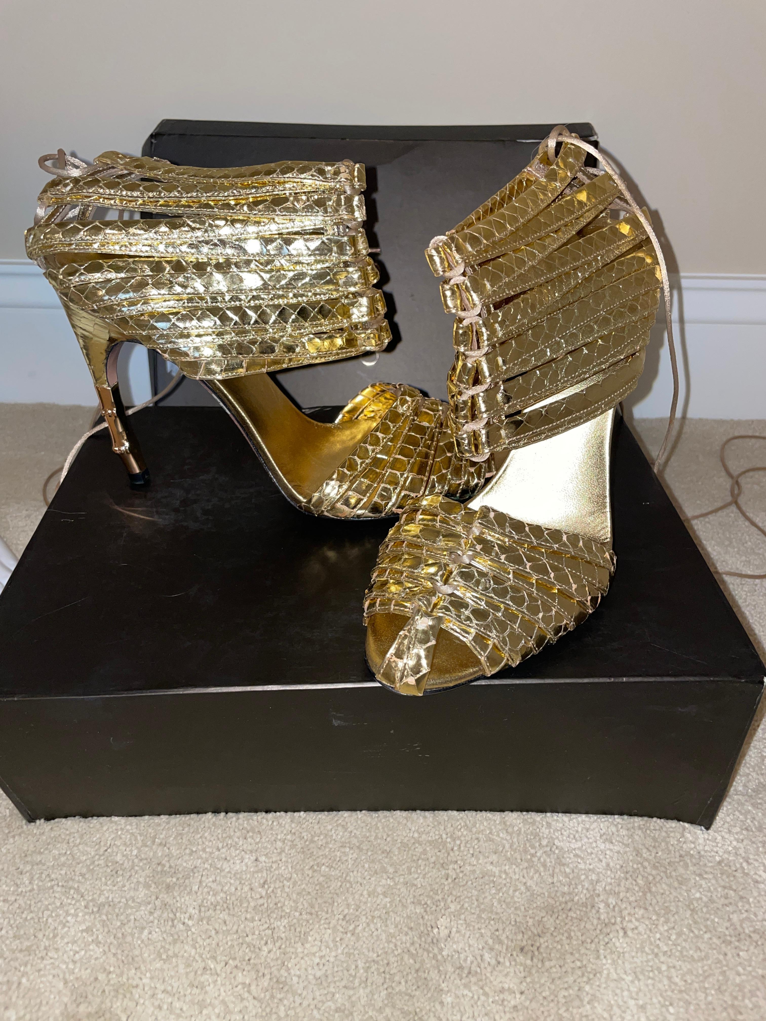 Vintage SS04 2004 Tom Ford for Gucci gold corset heels. New in box. The box is beat up, but I will include it anyways. Iconic heels seen on the runway and in the 04 ad campaign. Size 38.5 