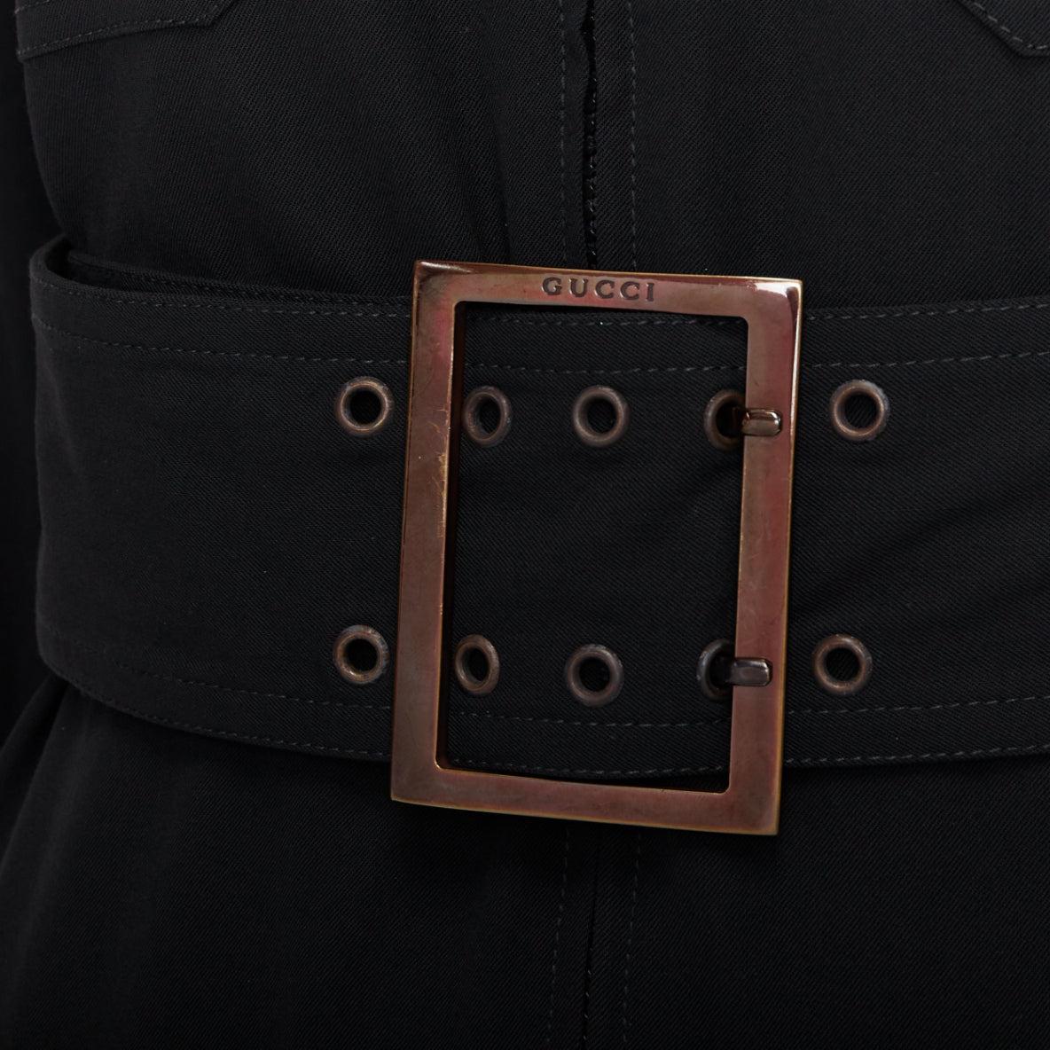 GUCCI Tom Ford 1996 black virgin wool belted military safari dress
Reference: PYCN/A00131
Brand: Gucci
Designer: Tom Ford
Collection: 1996 - Runway
Material: Virgin Wool, Blend
Color: Black, Silver
Pattern: Solid
Closure: Belt
Lining: Black