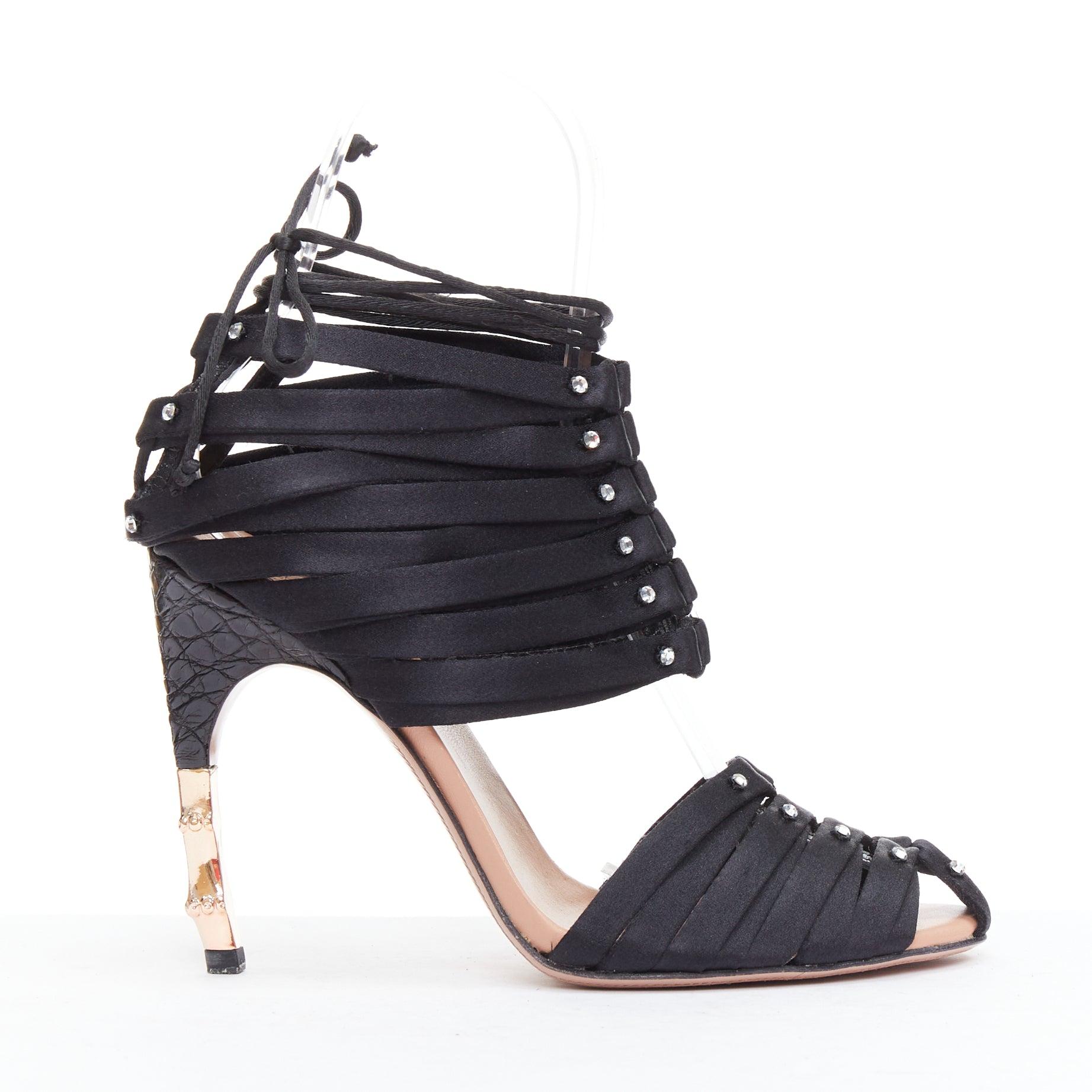 GUCCI Tom Ford 2004 Runway black satin corset crystal bamboo heels EU36C
Reference: TGAS/E00211
Brand: Gucci
Designer: Tom Ford
Collection: SS2004 - Runway
Material: Satin, Metal, Leather
Color: Black, Gold
Pattern: Animal Print
Closure: Lace