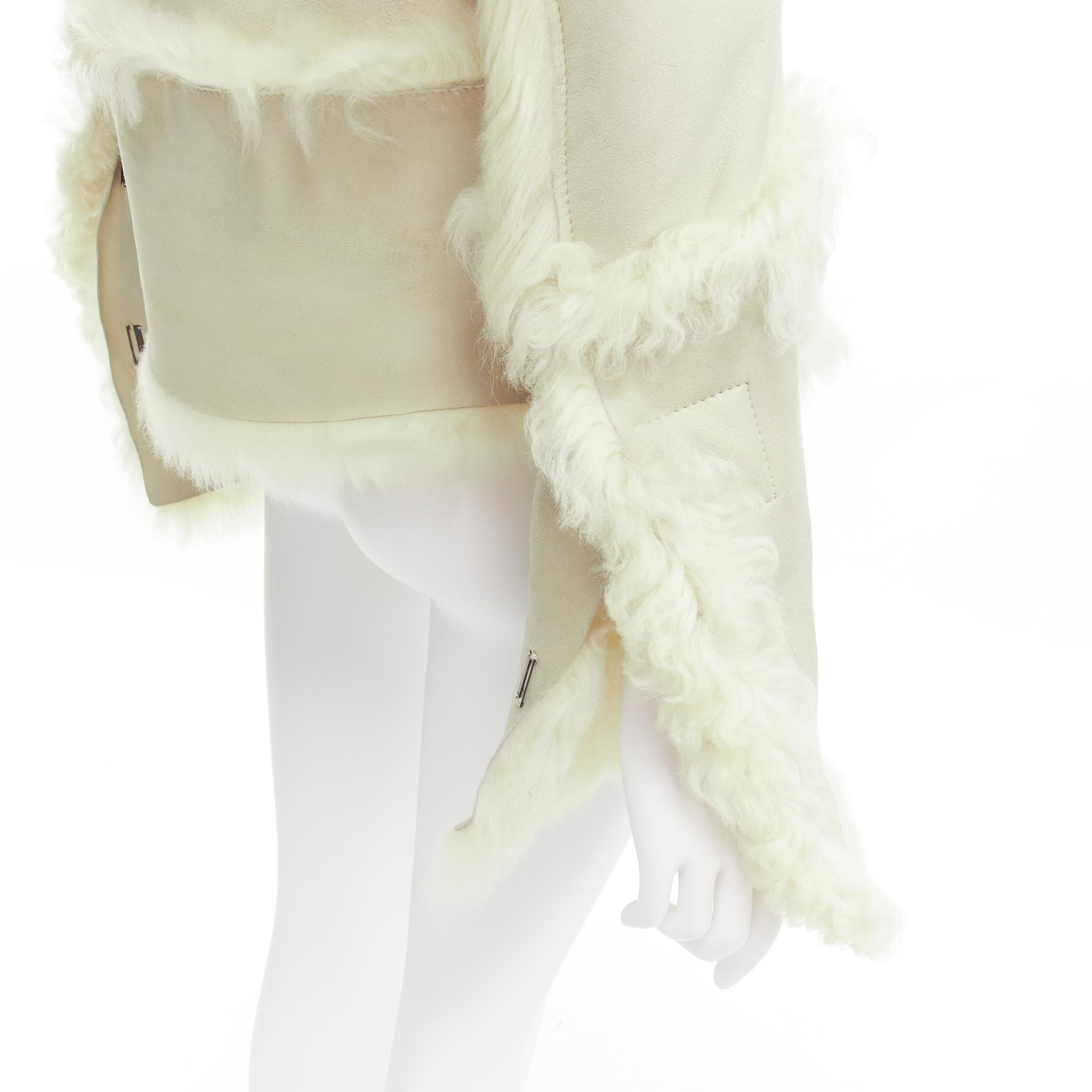 GUCCI Tom Ford cream shearling fur lined suede flared sleeve coat IT38 XS
Reference: TGAS/C02000
Brand: Gucci
Designer: Tom Ford
Material: Shearling, Leather
Color: Cream
Pattern: Solid
Closure: Hook & Bar
Lining: Cream Fur
Made in: