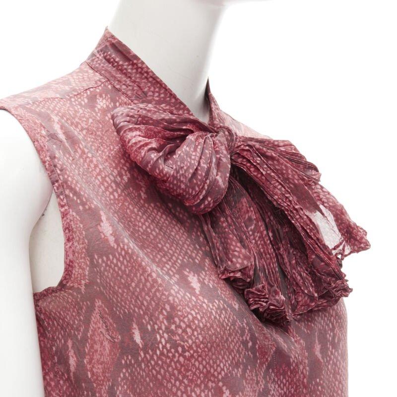 GUCCI TOM FORD Vintage 2000 pink scaled leather print bow collar blouse IT38 XS
Reference: ANWU/A00620
Brand: Gucci
Designer: Tom Ford
Collection: 2000
Material: Polyester, Silk
Color: Pink
Closure: Button
Extra Details: Knife pleat scarf detailing.