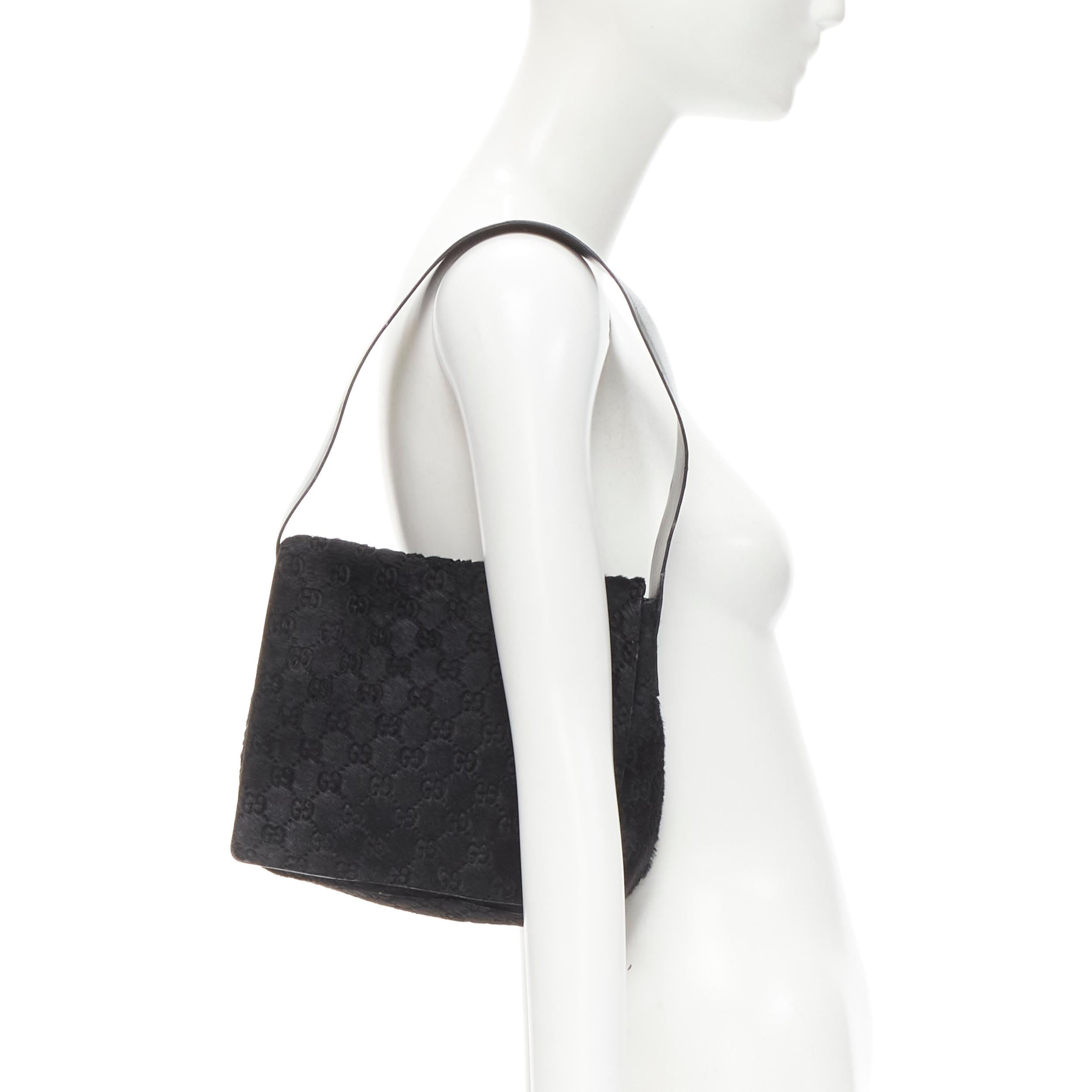 GUCCI TOM FORD Vintage black GG monogram calf hair GG embossed flap underarm bag
Brand: Gucci
Designer: Tom Ford
Material: Calf Hair
Color: Black
Pattern: Solid
Extra Detail: Flap front. Suede lining.
Made in: Italy

CONDITION:
Condition: Very good,