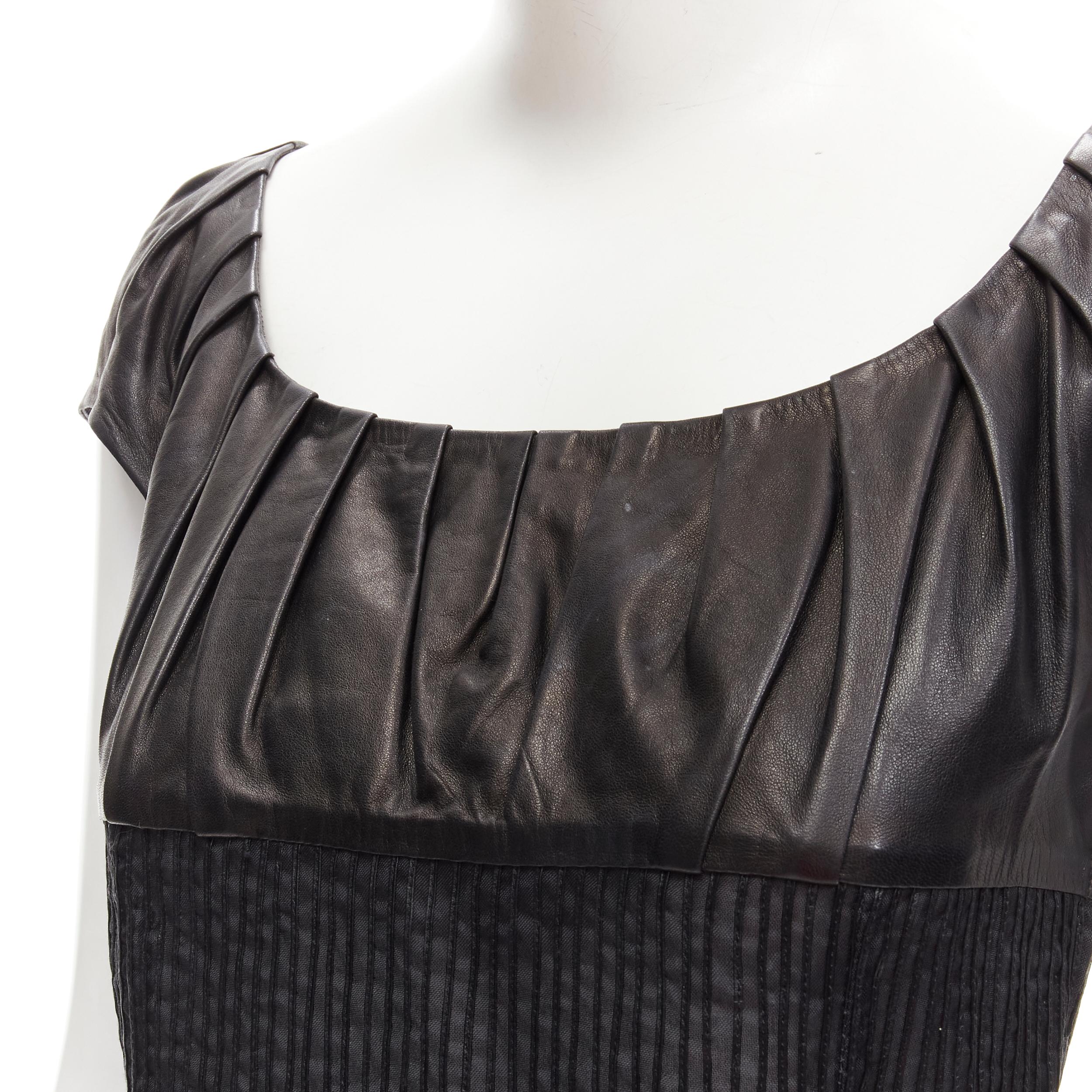 GUCCI TOM FORD Vintage black leather cap pleated sheer waist top S
Brand: Gucci
Designer: Tom Ford
Material: Leather
Color: Black
Pattern: Solid
Closure: Zip
Extra Detail: Square scoop neck. Cap sleeve. Pleated leather bust. Sheer bodice with