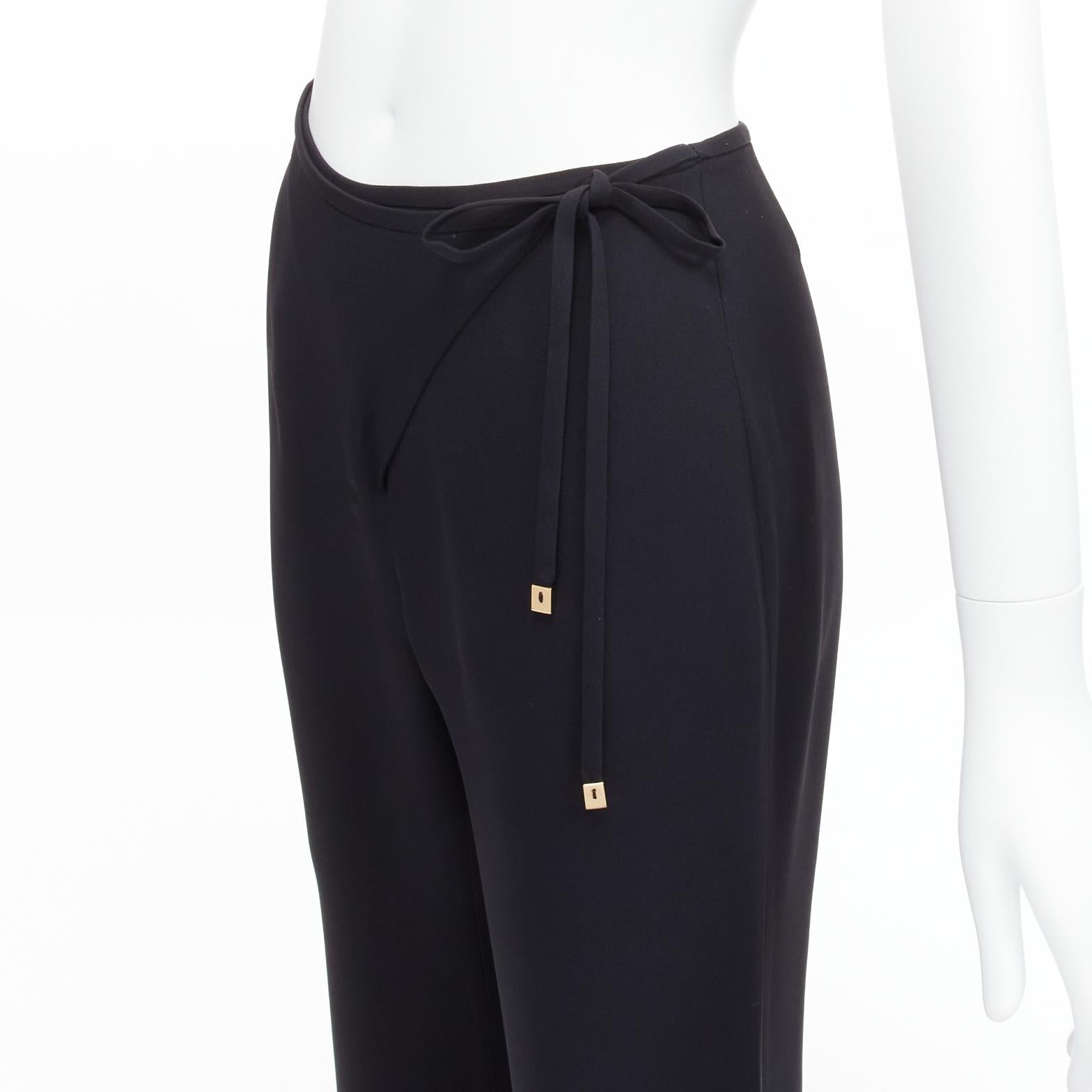 GUCCI Tom Ford Vintage black minimalistic charm tie waist wide leg pants IT40 S
Reference: TGAS/D00389
Brand: Gucci
Designer: Tom Ford
Material: Rayon, Acetate
Color: Black, Gold
Pattern: Solid
Closure: Wrap Tie
Lining: Black 
Extra Details: Wrap