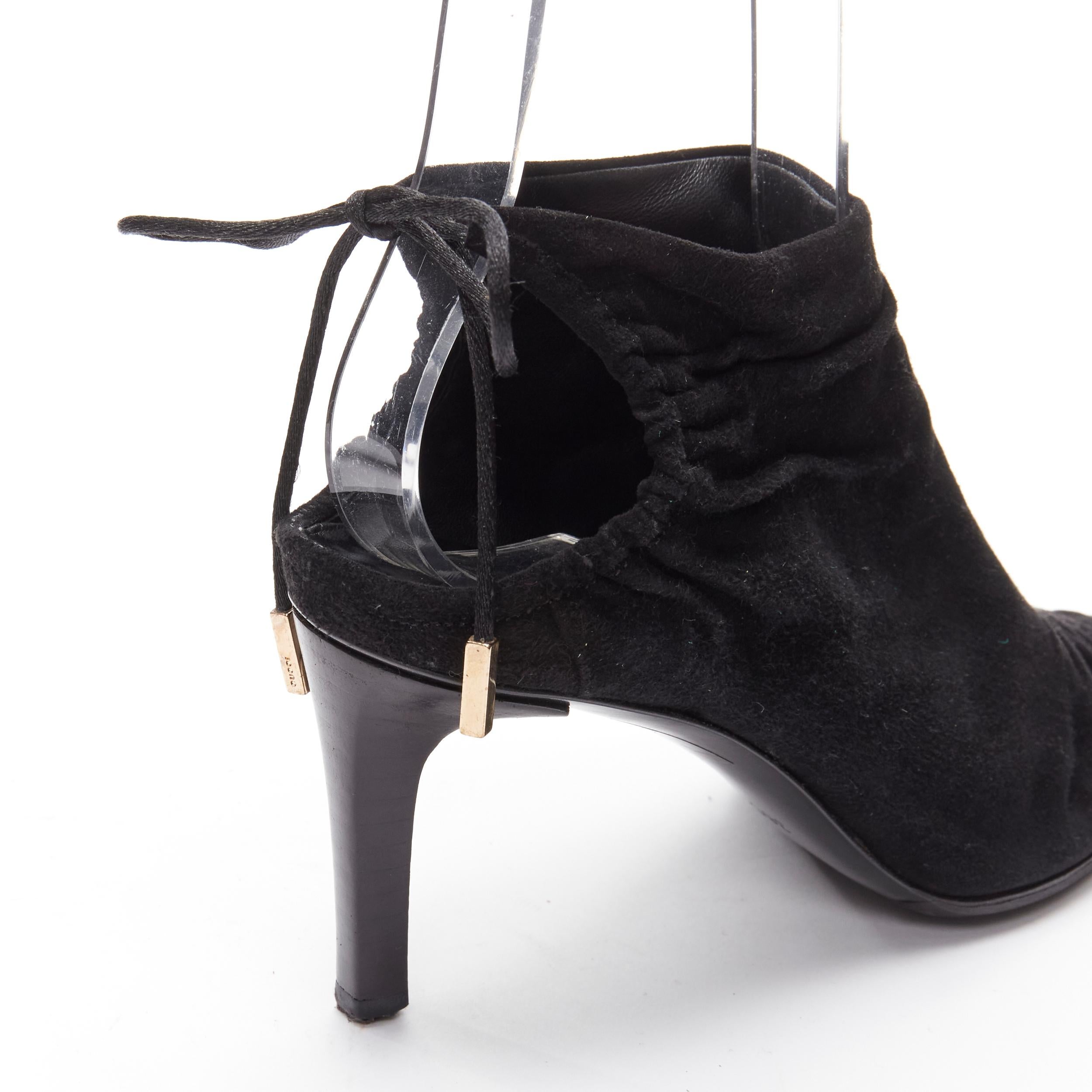 GUCCI Tom Ford Vintage black suede leather ruched toe tie back bootie EU36C
Reference: ANWU/A01051
Brand: Gucci
Designer: Tom Ford
Material: Suede
Color: Black
Pattern: Solid
Closure: Self Tie
Lining: Leather
Extra Details: Leather tie back with