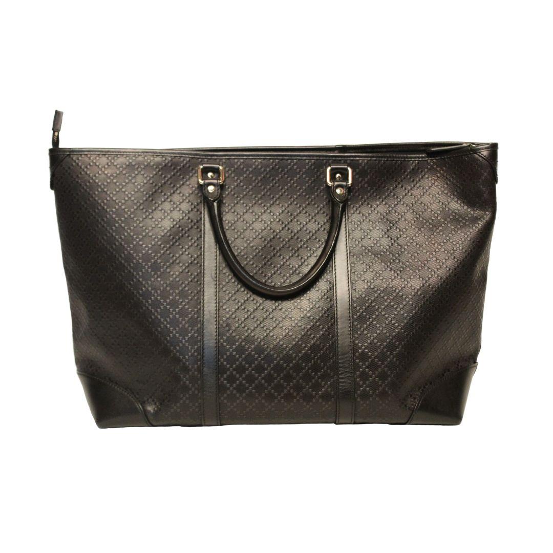 Beautiful midnight black leather GUCCI tote bag with dual rolled handles and silver hardware.

Featuring inner zip compartment as well as full zip closure to secure valuables in this spacious bag.

Leather is embossed with gorgeous a diamante