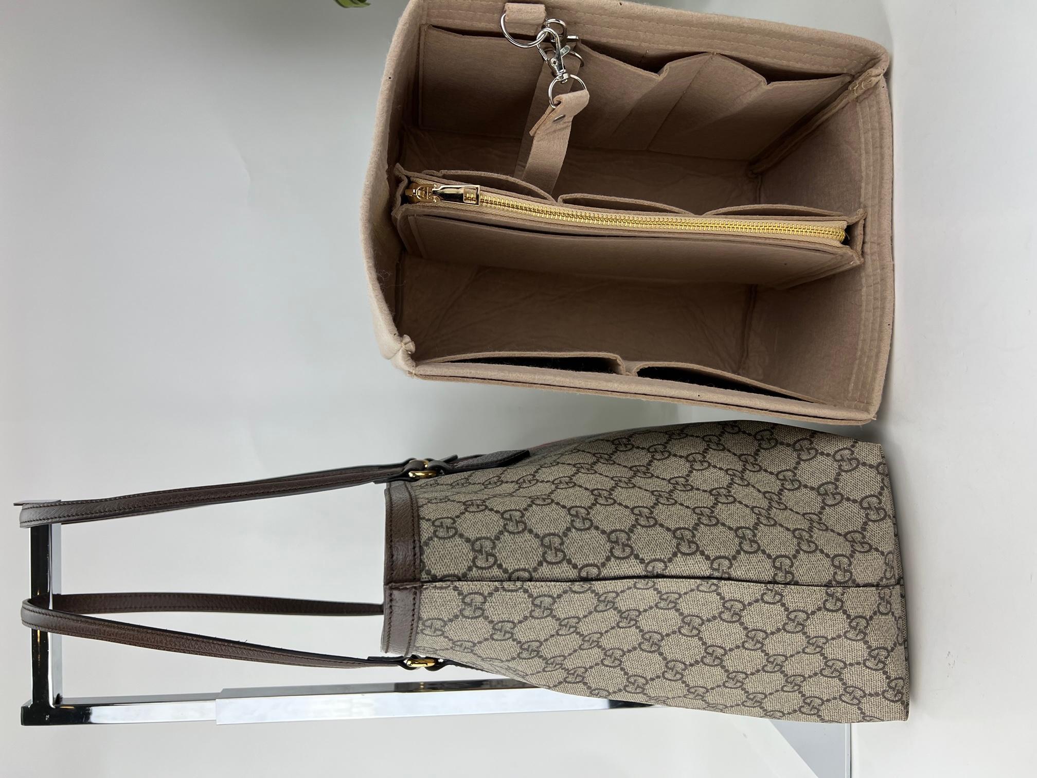 Pre-Owned  100% Authentic
Gucci Ophidia GG medium tote With
Added Insert to help Organize and
Keep Shape
RATING: A...excellent, near mint, only
slight signs of wear
MATERIAL: Beige/ebony GG Supreme
canvas, brown leather trim
HANDLE: brown double
