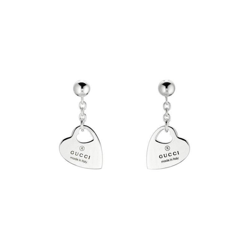 Dive into the epitome of elegance and sophistication with the Gucci Trademark Pendant Heart Charm Earrings, model number YBD796312001. These exquisite earrings are not just accessories; they are a statement, a testament to the unparalleled