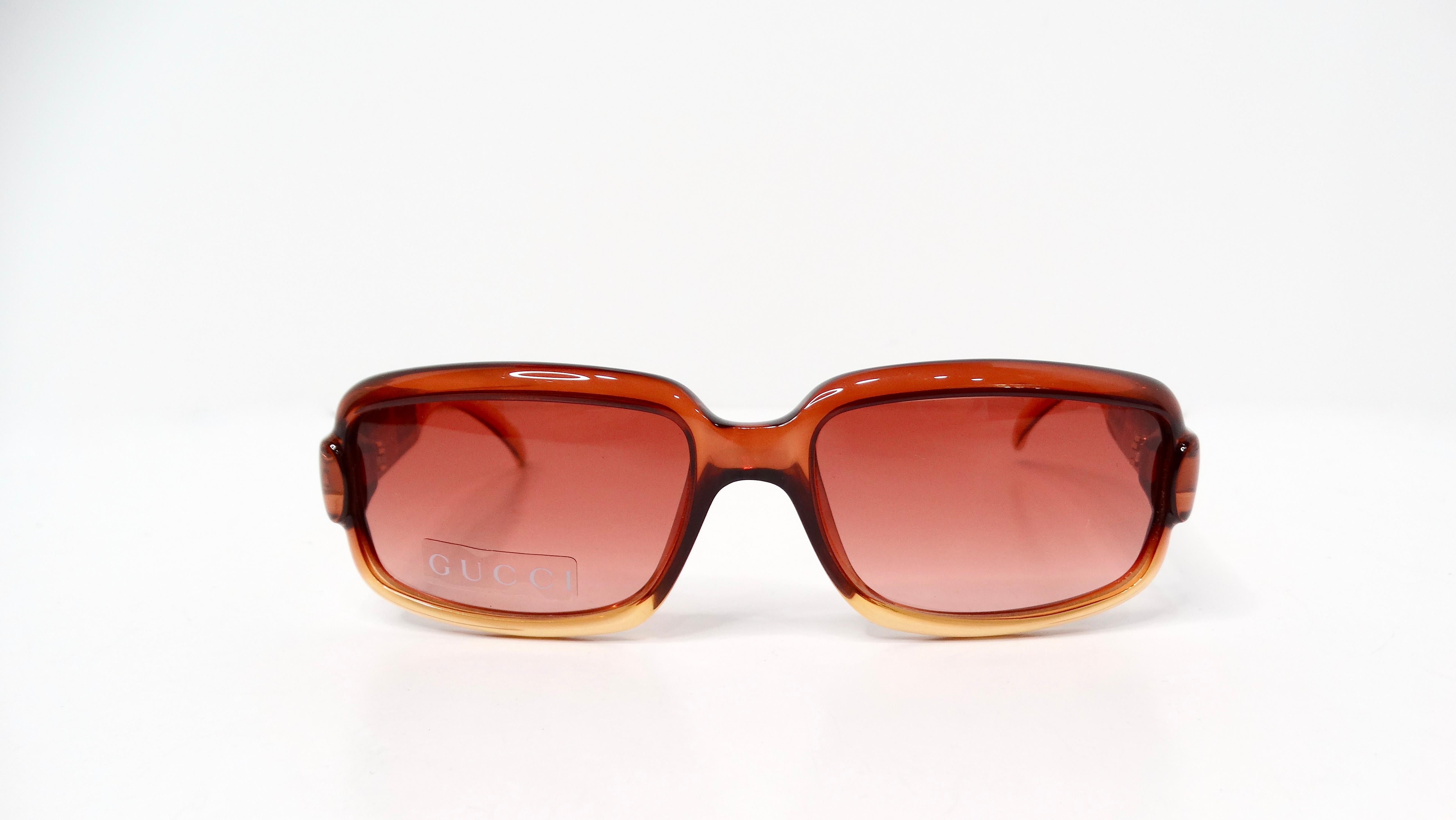 The Gucci Translucent Brown Square Ombre Gradient Sunglasses embody a striking blend of modern elegance and classic luxury. Featuring a warm orangey brown tone with a chic ombre effect, these sunglasses not only offer superior UV protection but also