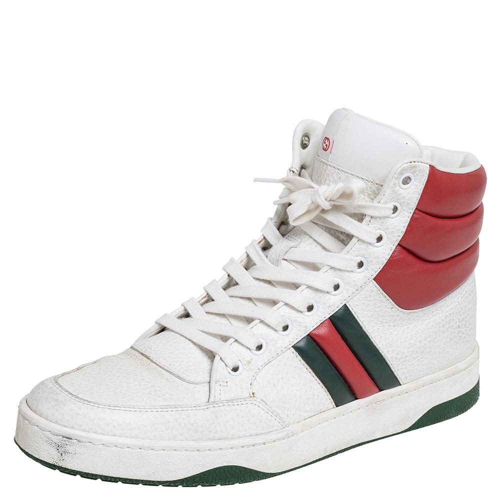 These Gucci high-top sneakers are characterized by recognizable elements and unmatched comfort. Crafted from leather, these sneakers have lace-up closure, Web trims, and white rubber soles finished in green.

