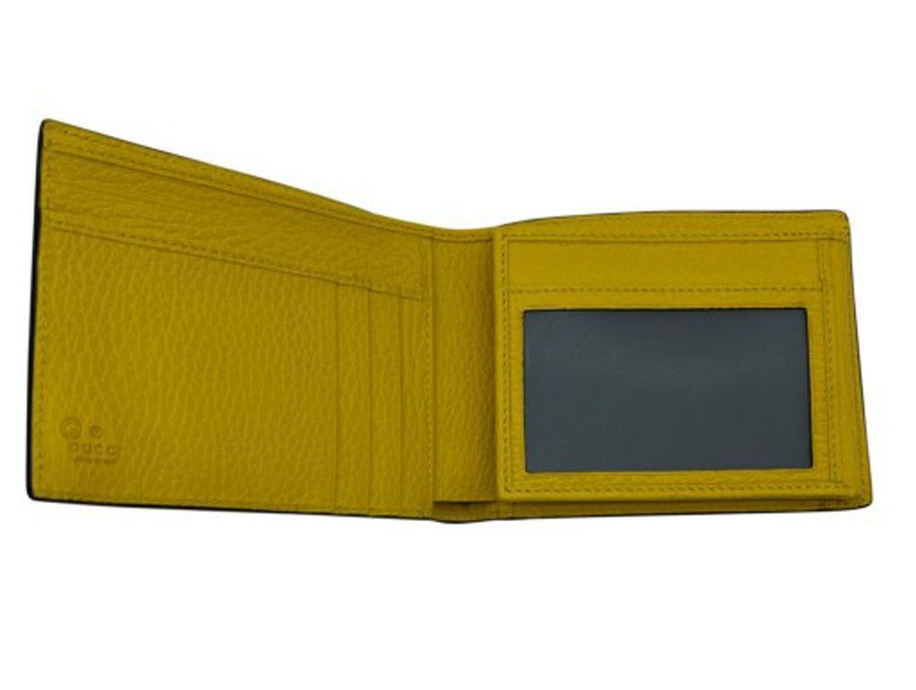 Lovely tri-fold wallet from Gucci in black and yellow leather. Purchased and stored, never used.

BRAND	
Gucci

ACCESSORIES	
Box, Care card, Dust cover 

COLOUR	
Black, Yellow

CONDITION	
As New

FEATURES	
Made in italy, 4 credit card slots, section