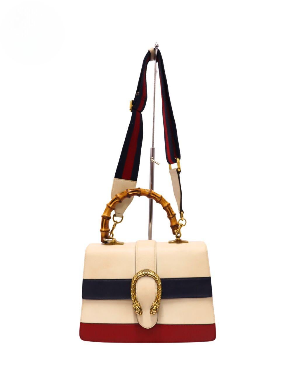 Gucci Tricolor Dionysus Bamboo Top Handle Bag, Features tiger head, flap closure, bamboo handle, removable shoulder strap, one interior pocket and inspired by the Greek God Dionysus.

Material: Leather
Hardware: Gold
Height: 18.5cm
Width: