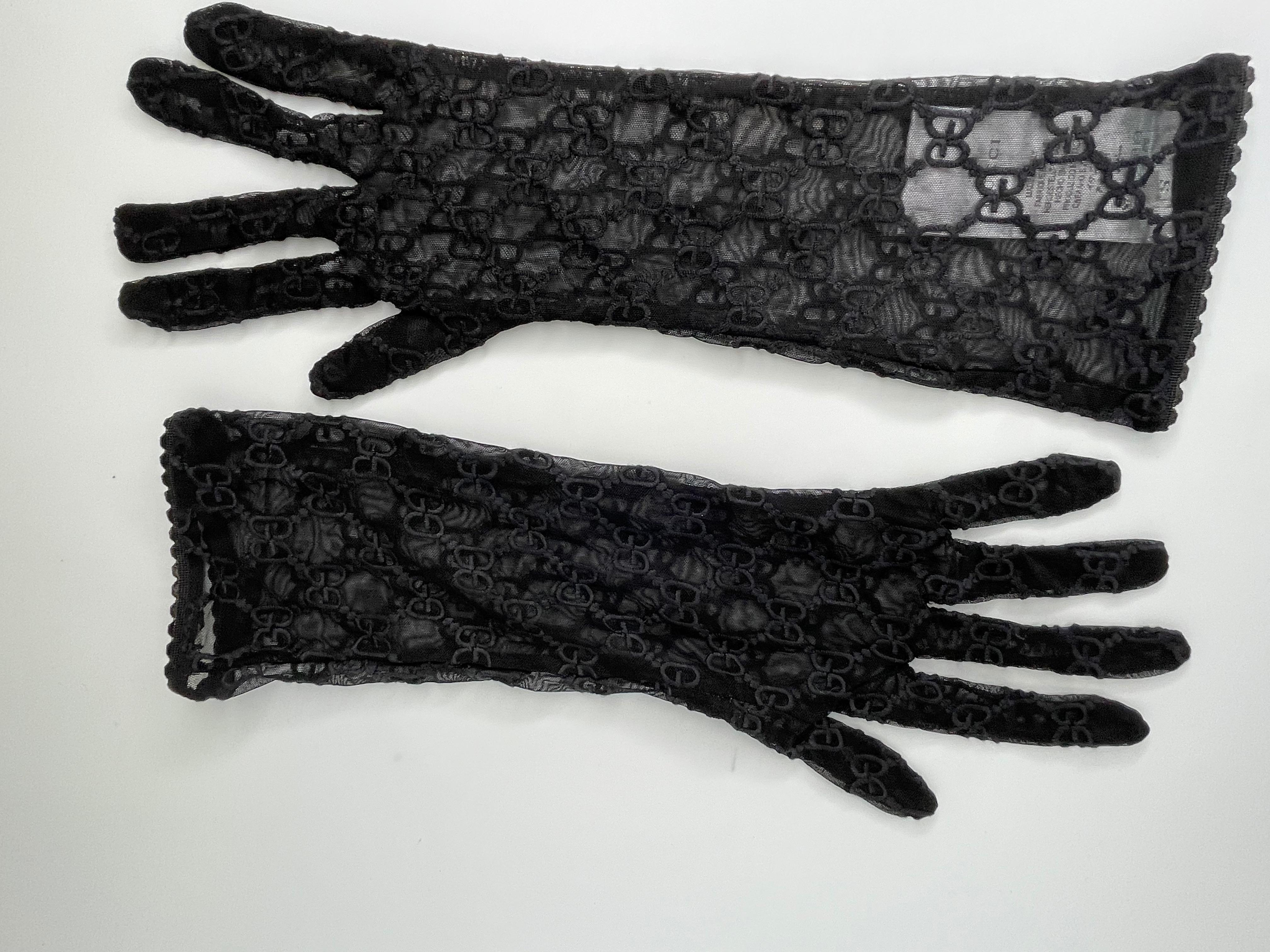 Developed in a new, delicate variation, the historical GG motif from the 1970s is embroidered onto a pair of black tulle gloves.

COLOR: Black
MATERIAL: 73% polyamide 27% elastane; 100% polyester (embroidery)
ITEM CODE: 432086
SIZE: Small