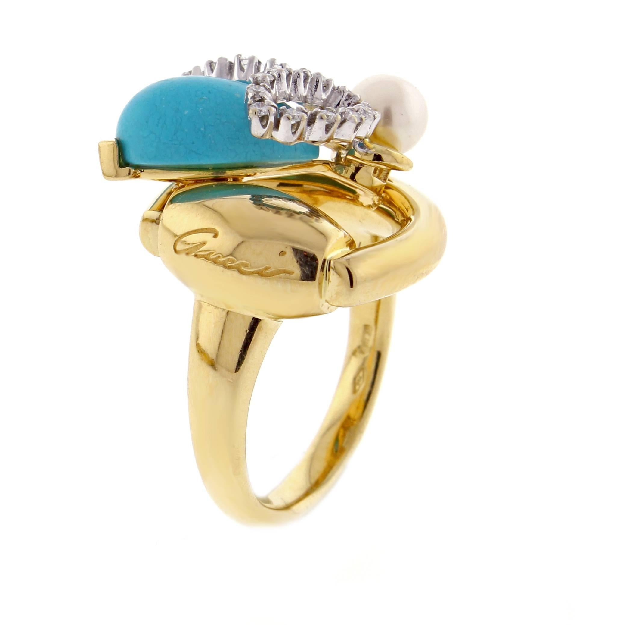 From Gucci, this whimsical ring featuring a turquoise and diamond bee landing on an 18 karat gold horse bit. 26 diamonds weigh .13 carats. size 6½