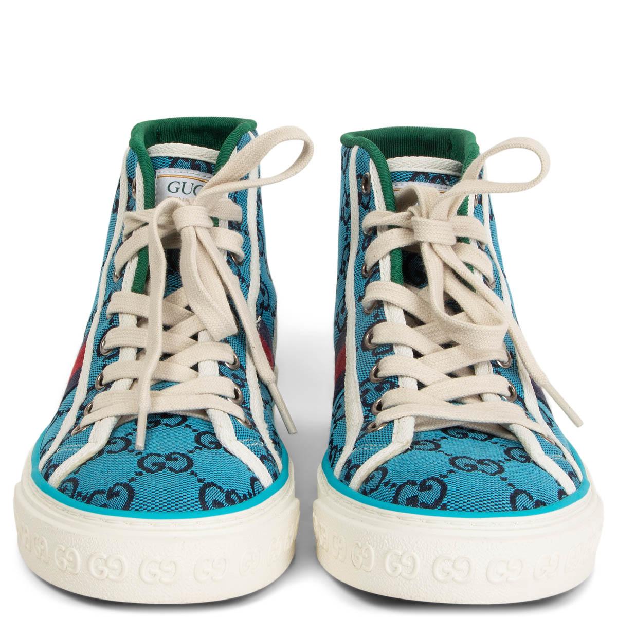 100% authentic Gucci Tennis 1977 high-top sneakers in turquoise and navy monogram canvas with the iconic red and navy Web stripe on the side and white canvas trimming. GG motif at the sole. Brand new. Come with dust bag and extra laces.