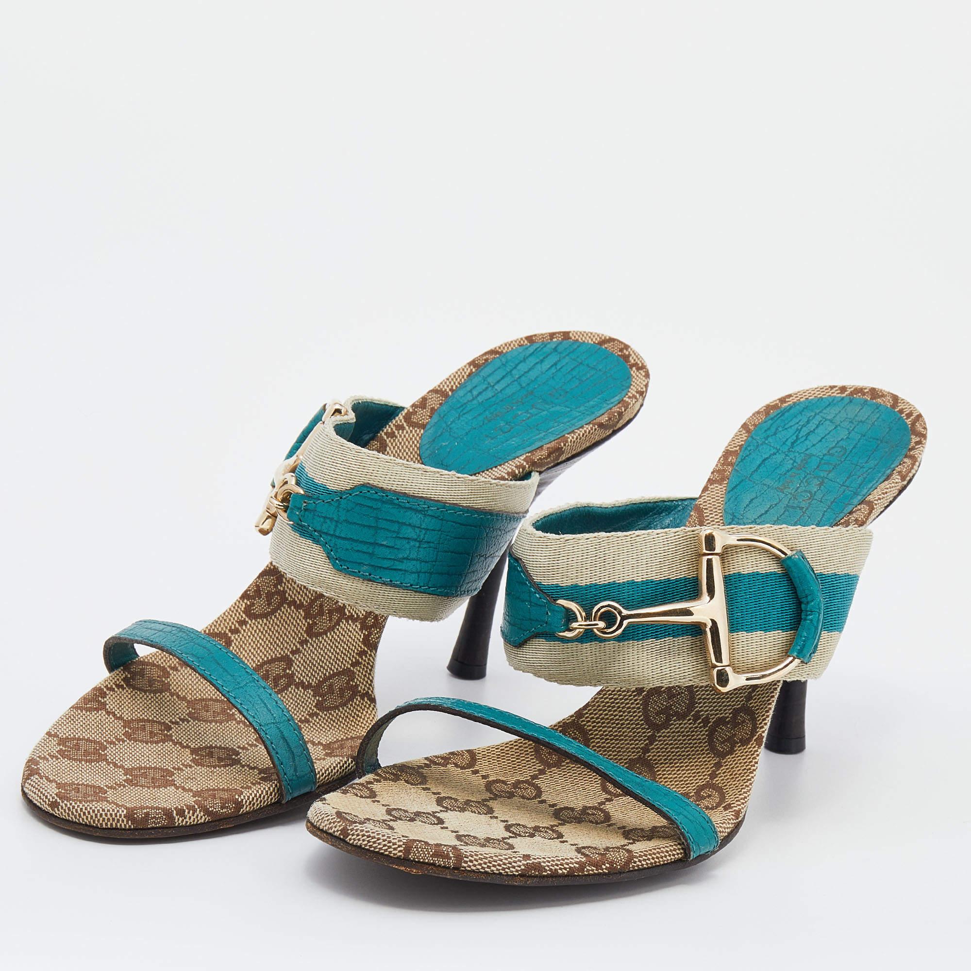 These Gucci slide sandals are crafted from leather and Web tape into an open-toe silhouette. They are embellished with signature accents and elevated on 9.5 cm heels.
