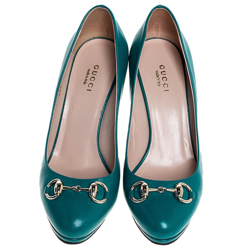 These classic Gucci pumps make for an ideal formal as well as informal wear. Crafted in turquoise leather, the pumps feature horsebit detailing in gold-tone on the uppers. Pair these lovely pumps with your favorite outfit for a high