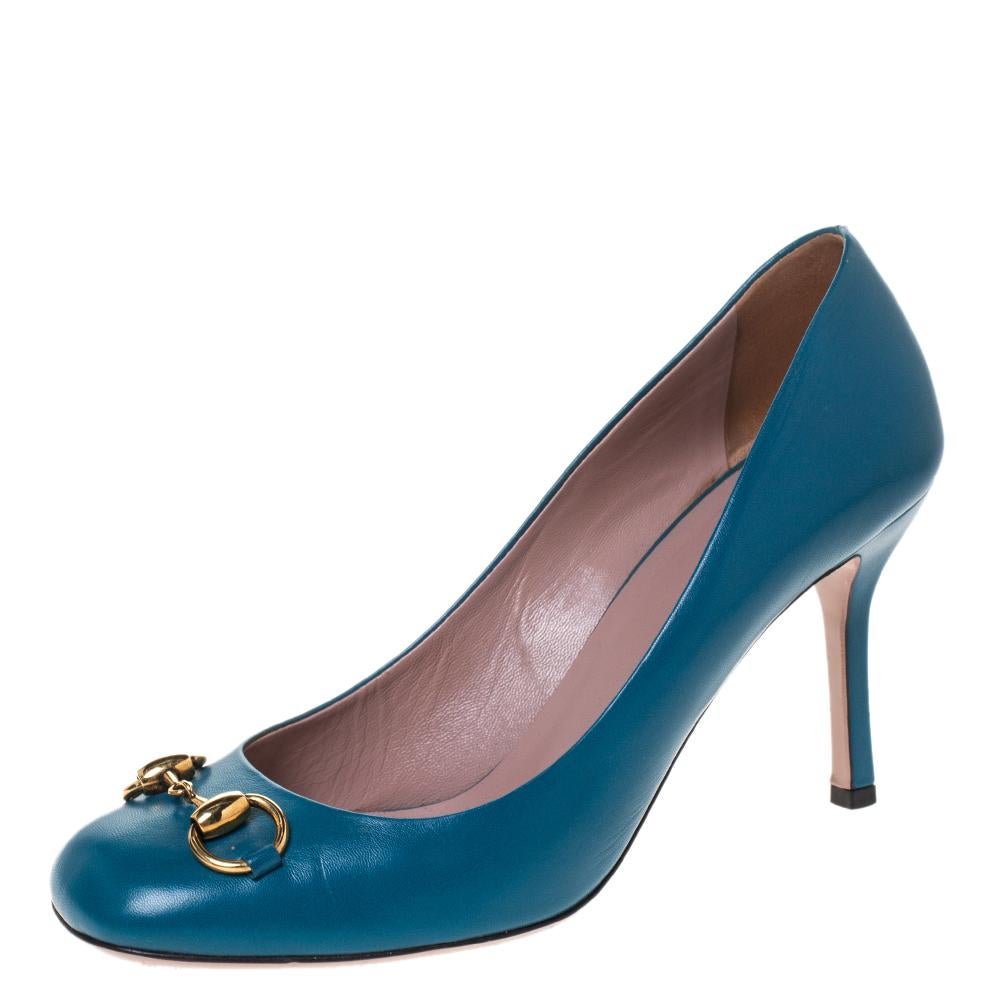 Featuring a chic, minimalist design, these pumps from Gucci are easy to style. The turquoise patent leather exterior showcases the signature Gucci Horsebit in gold-tone. 9 cm heels and square toes form a distinctive outline. The simple design pairs