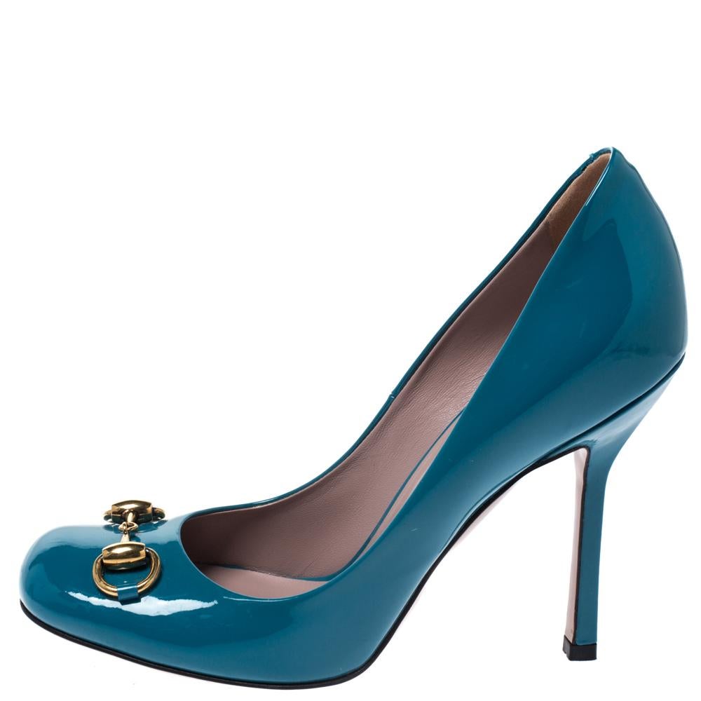 Featuring a chic, minimalist design, these Jolene pumps from Gucci are easy to style. Blue patent leather uppers showcase the signature Gucci Horsebit in gold-tone. High stiletto heels and square toes form a distinctive outline. Their simple design