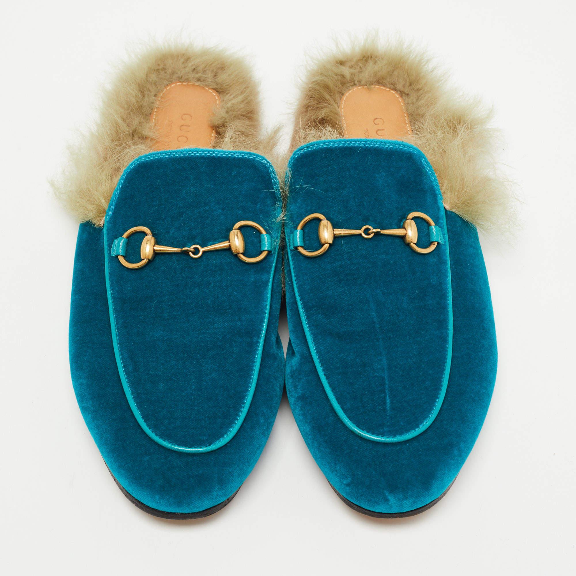 These Gucci Princetown mules signify luxury and practicality. An ultimate favorite of style enthusiasts, its silhouette gets a luxe update with the Horsebit motif on the uppers. It comes made from velvet along with fur and features a slip-on