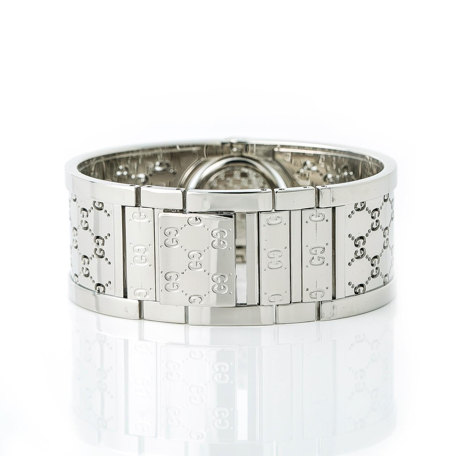 Gucci Twirl Reference #:112. Gucci Twirl 112 Womens Quartz Watch Bronze Dial Bangle Stainless Steel 16mm. Verified and Certified by WatchFacts. 1 year warranty offered by WatchFacts.
