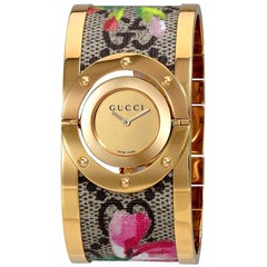 Gucci Twirl Bloom Gold drehendes Zifferblatt Uhr YA112443