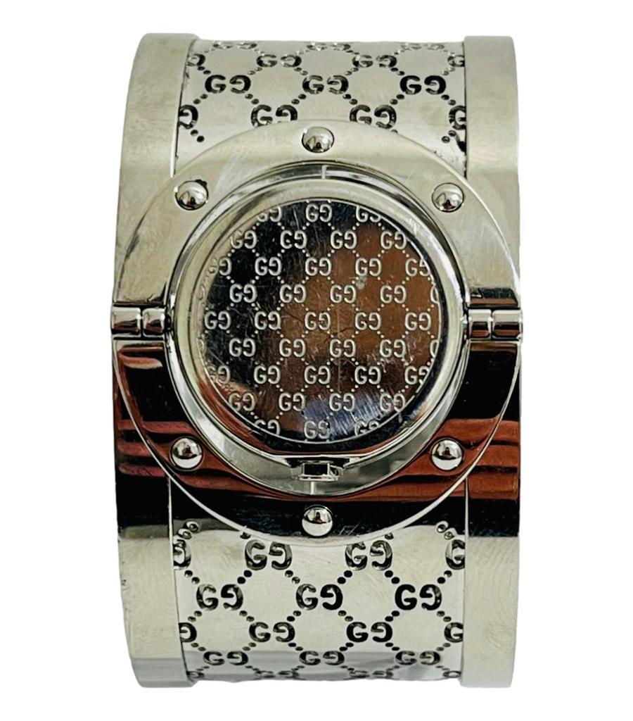 Rare Model - Gucci Full Pave Diamond Face - Twirl Watch 

This is a rare version of this watch with full brilliant white pave diamond face.

Twist the face to wear either with watch face showing or just as a bangle with 

the logo showing. Sapphire