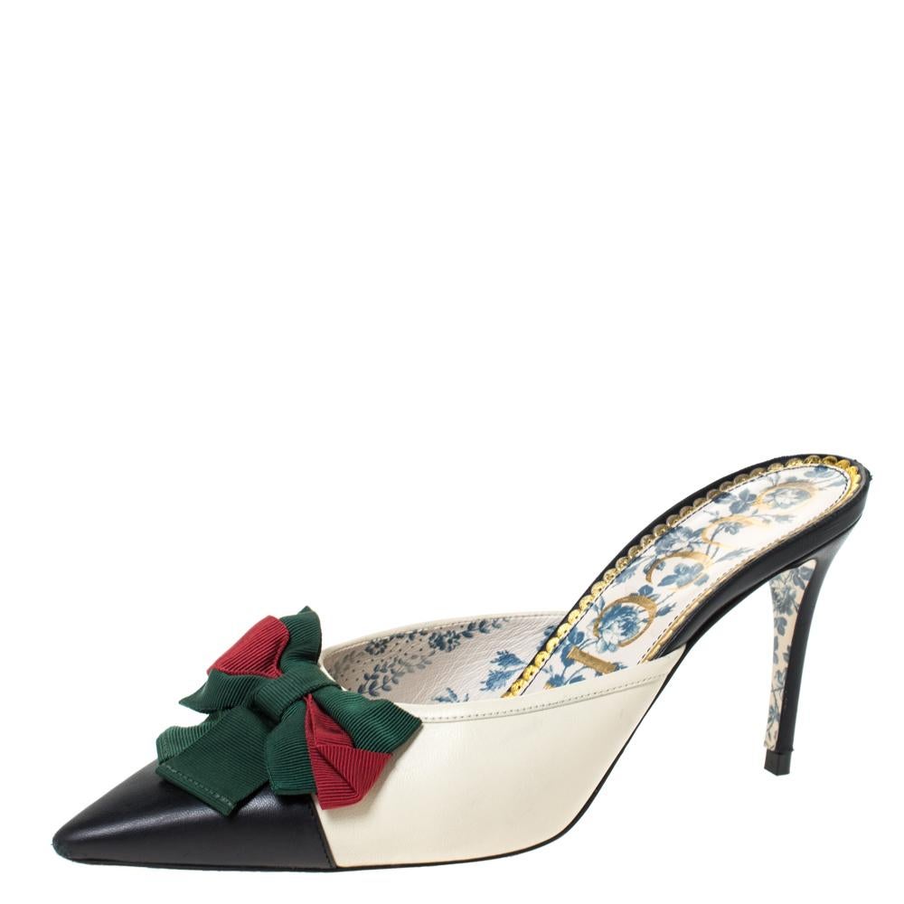 These lovely mule slides by Gucci are perfect for brunches and fun outings. Crafted from quality leather in Italy, they come in lovely hues and are styled in a sophisticated fashion. They have pointed toes, web bows on the uppers, 9.5 cm heels and