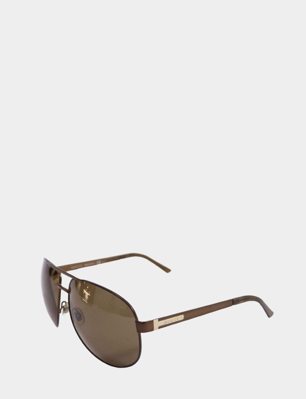 Gucci Unisex Aviator Sunglasses, Featuring a Brown Lenses, logo text on arms, and 100% UV protection.

Hardware: Acetate
Lens: Brown
Lens Width: 61mm
Lens Bridge: 14mm
Arm Length: 125mm
Overall Condition: Light scratch
*Includes box