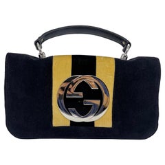 Gucci - Sac à rabat GG Soho à rayures blondes