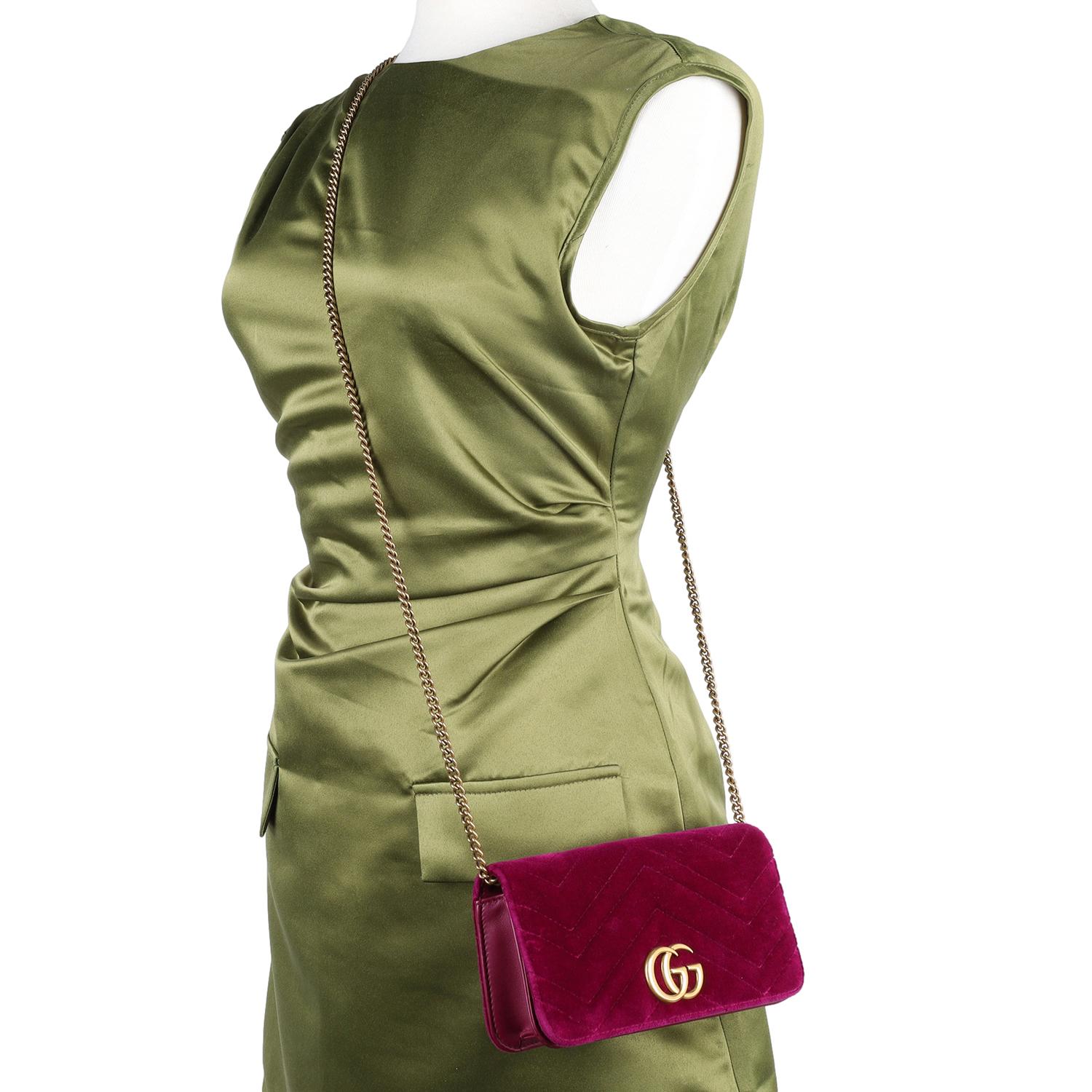 Authentic Gucci GG Velvet Matelasse Marmont Mini Cross body bag. This classic Gucci violet purple cross body bag makes a perfect everyday bag. Features GG logo on the front, magnetic snap top closure, roomy pink interior. This elegant tote will be