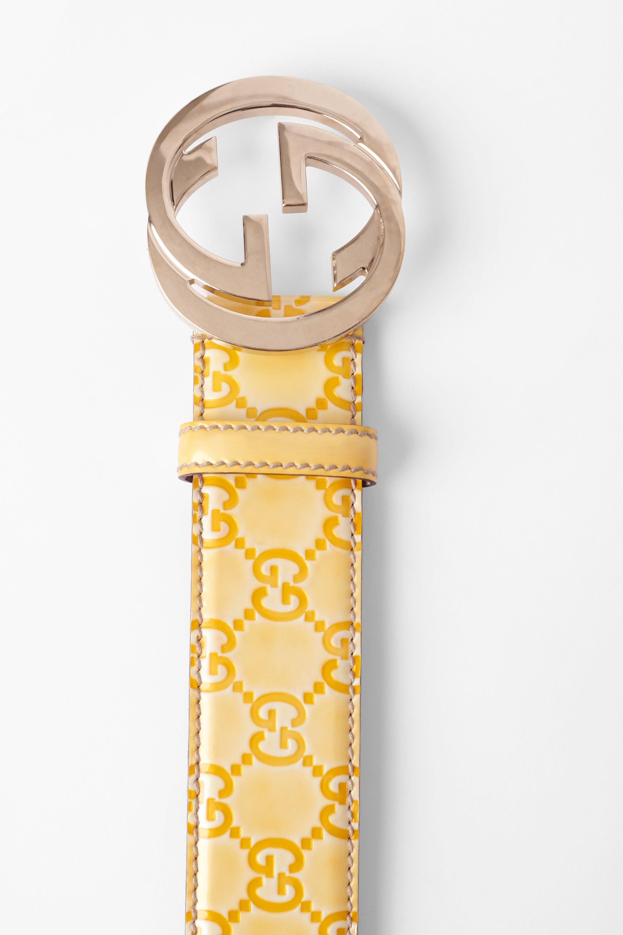 Vintage 1990’s canary yellow leather belt by Gucci. Feature the iconic GG logo embossed all over, and silver front hardware  GG logo for closure. In excellent condition. 

Brand: Gucci
Color: Yellow
Fabric: Leather
Year / Season: Circa late
