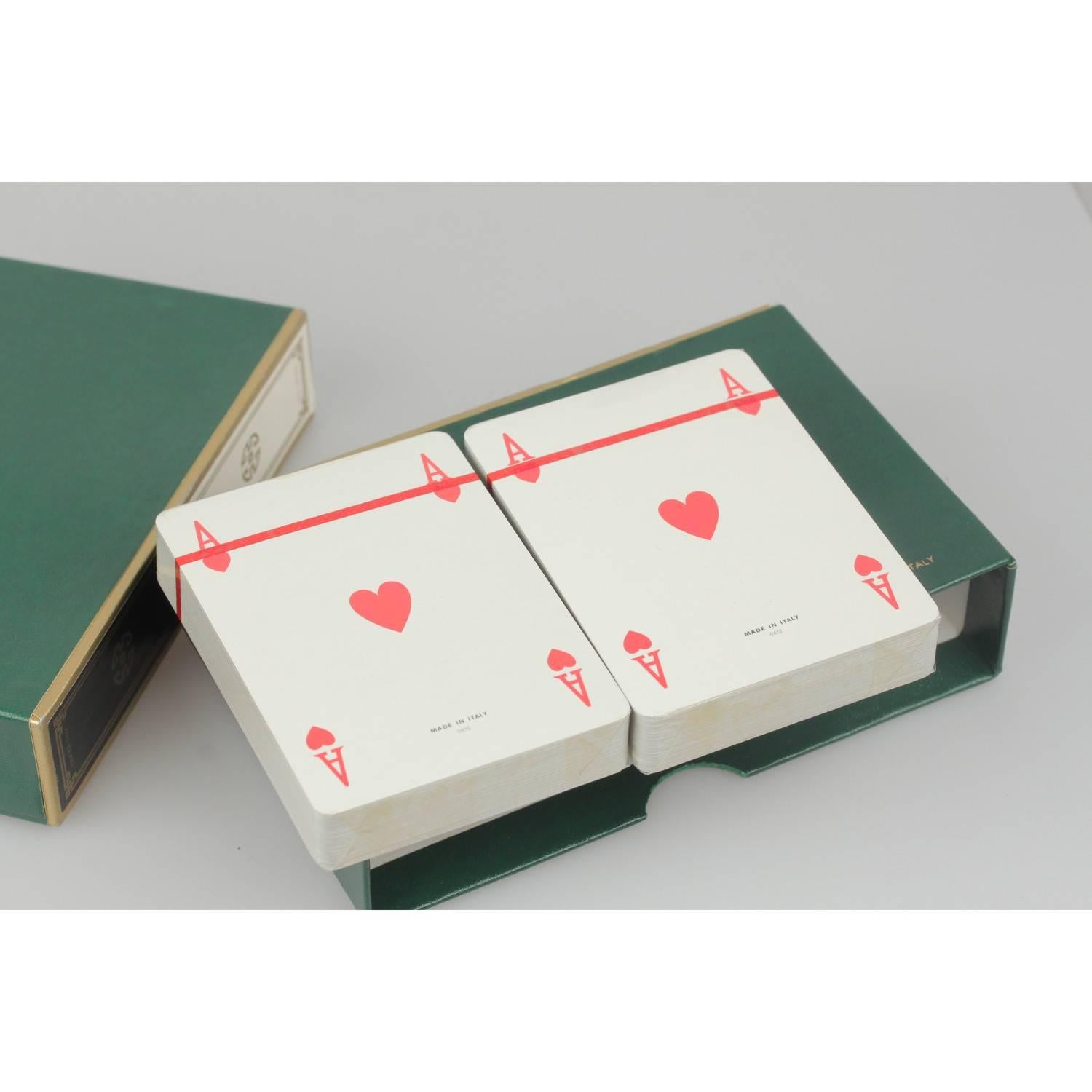 - Very nice & unique GUCCI vintage boxed set of French playing cards 
- 2 Decks in 2 different color (Black, White) 
- GG - GUCCI logo on the back of every card 
- Each deck is wrapped
- The cards are housed in a green GUCCI box 
- Measurements of